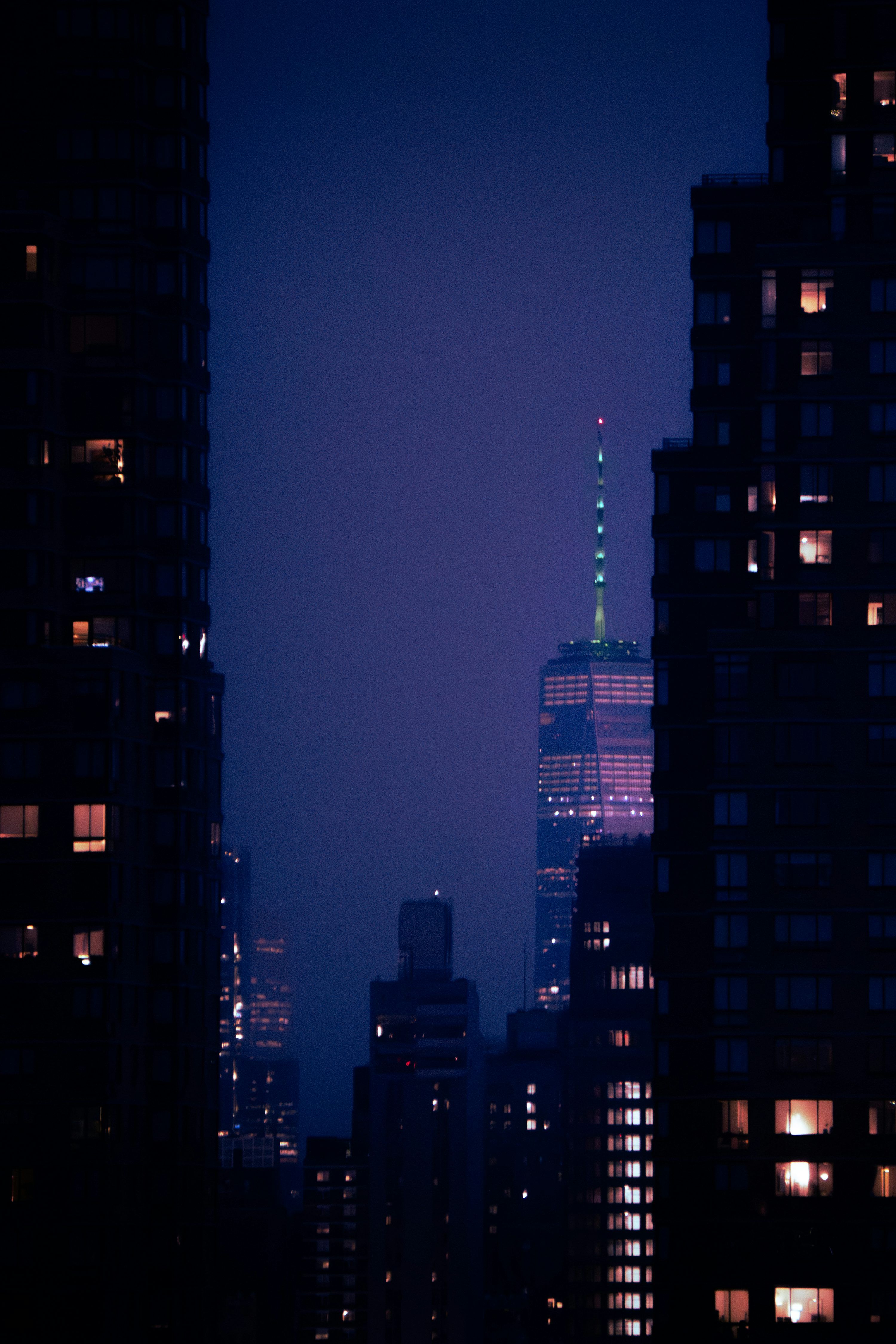 3000x4500 Skyscrapers illuminated against a dark night sky. photo