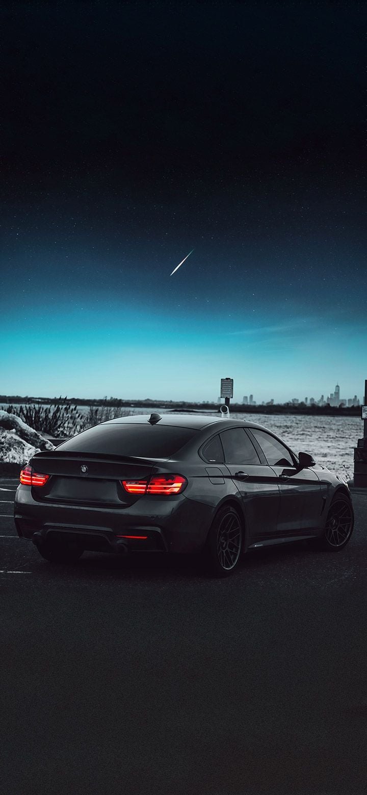 720x1560 Black BMW on a dark night wallpaper