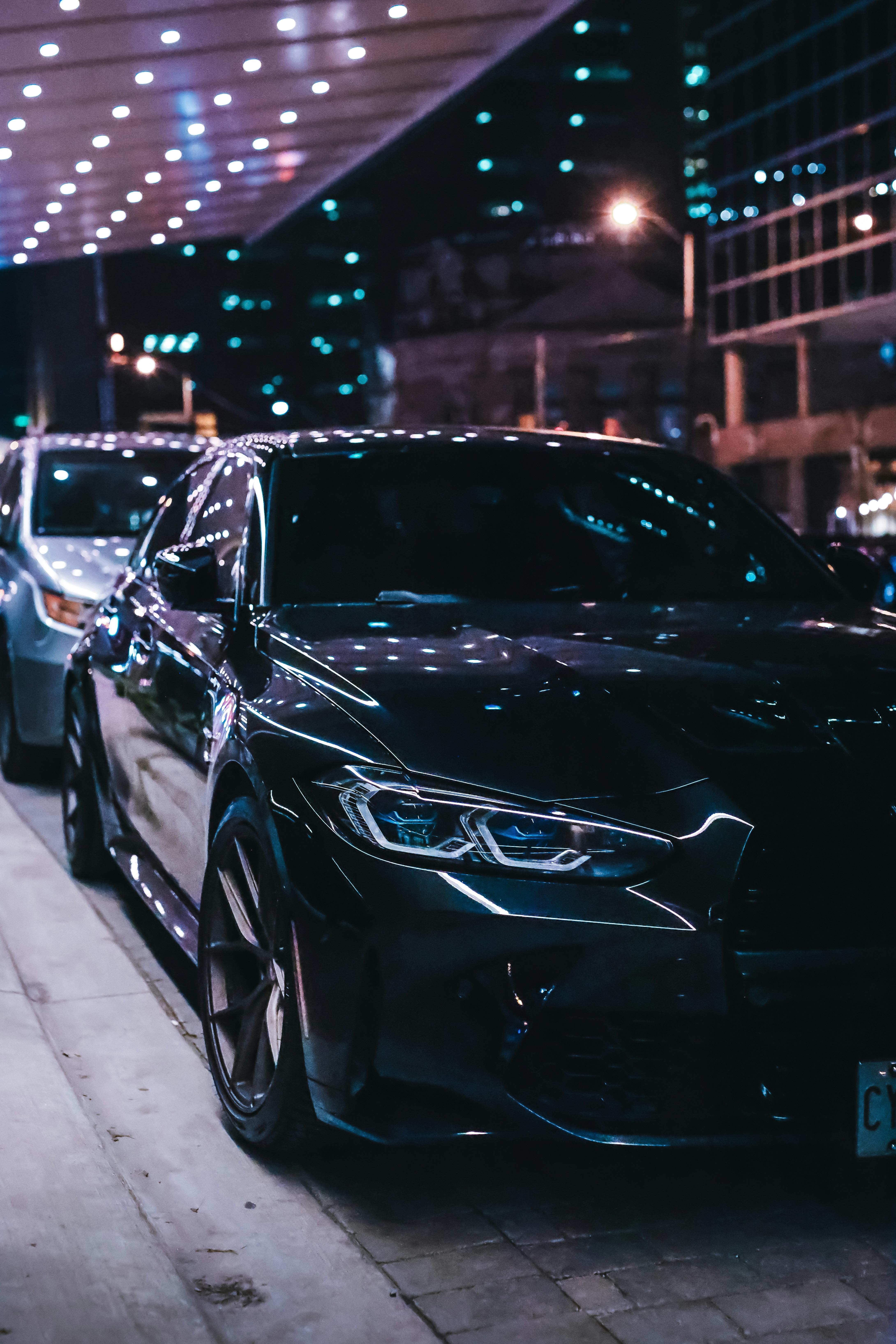 4360x6540 A BMW M3 Parked on the Side of a Street at Night · Free