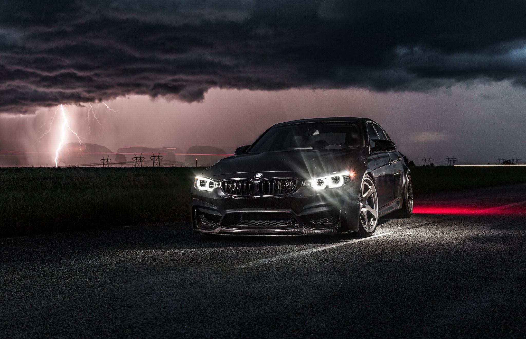 2048x1319 BMW M3 Nightstorm: Black Beast Strikes Under Lightning Skiesx1319