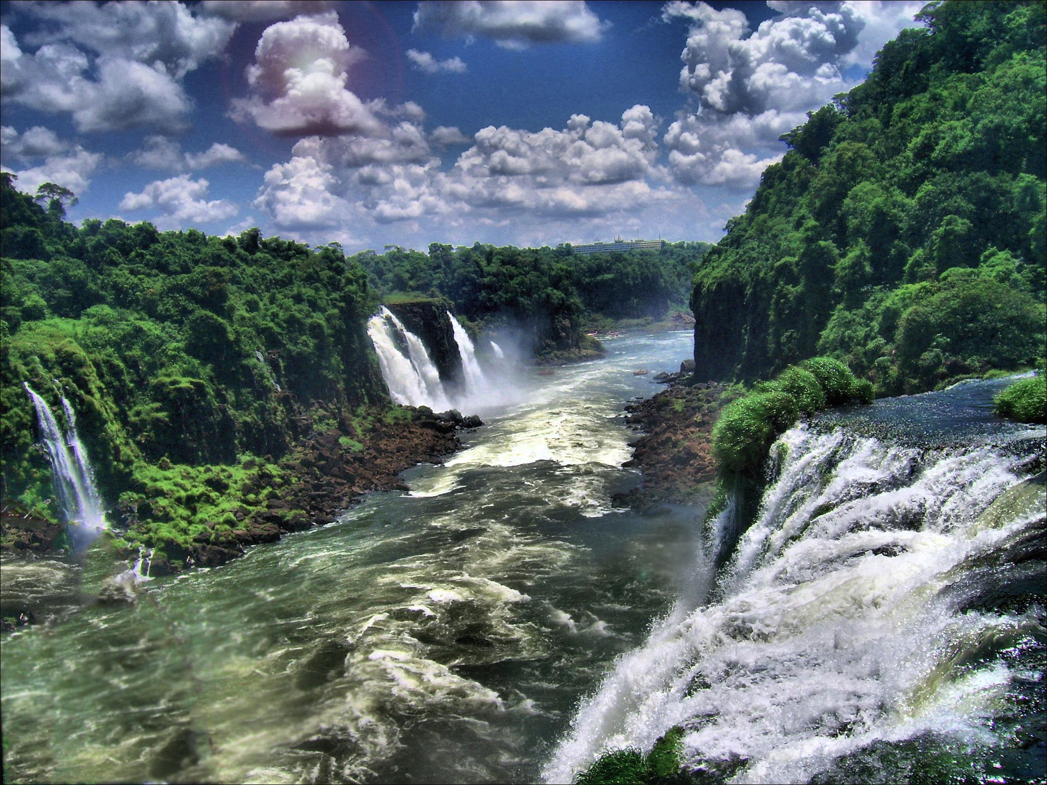 2048x1536 Iguazu Falls: Majestic Cloudy Sky Wallpaperx1536