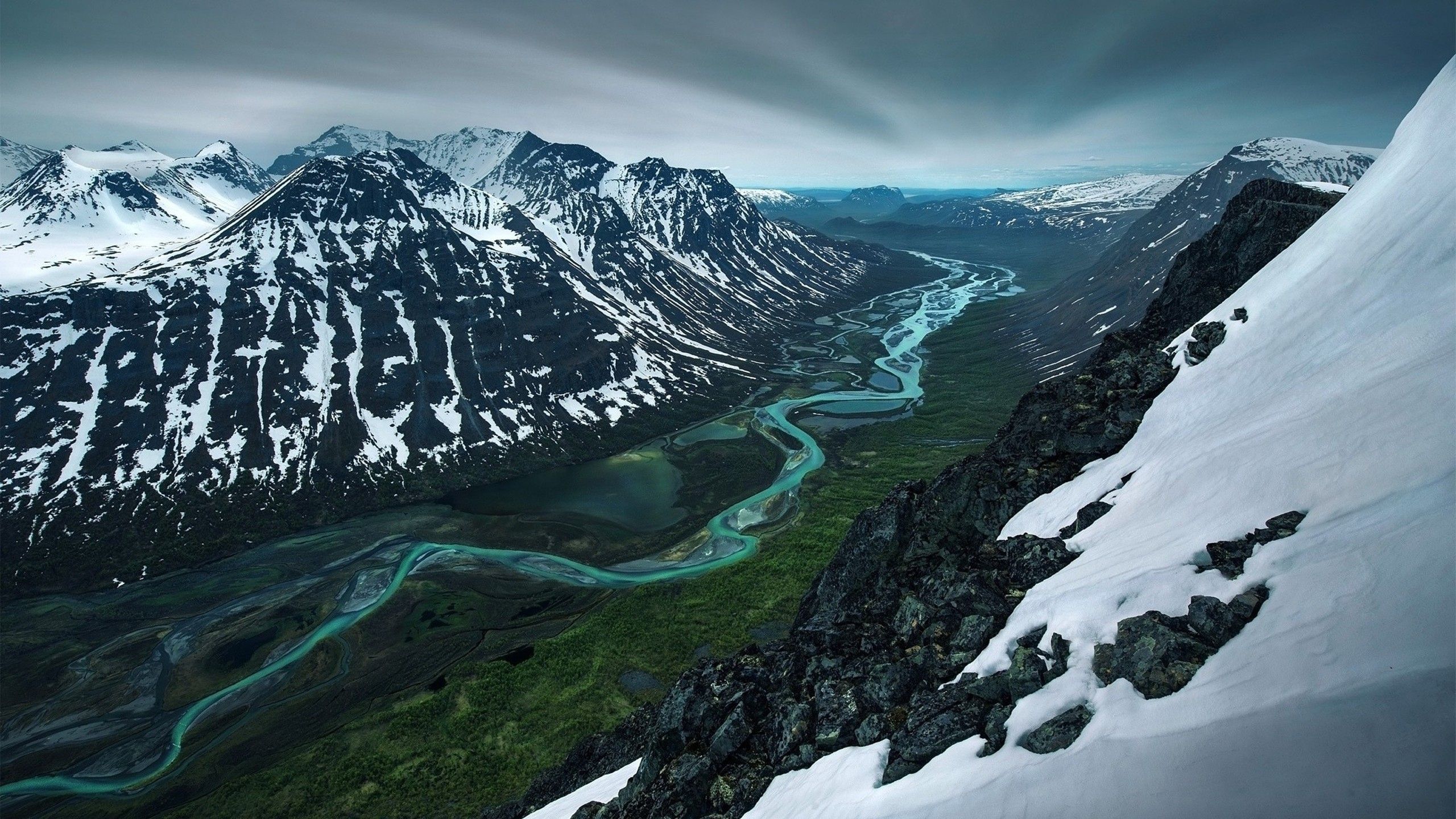 2560x1440 Sweden Valley River Between Snow Covered Mountain HD Nature Wallpaper