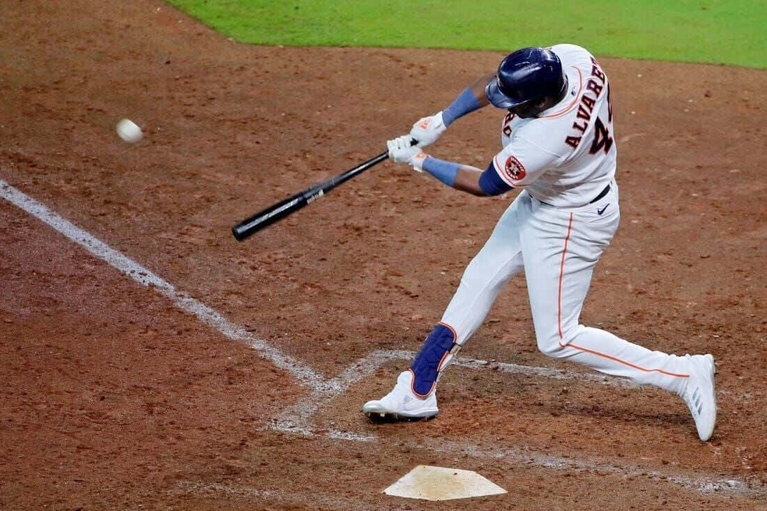 1100x733 Download Yordan Alvarez Swinging Baseball Action Wallpaper