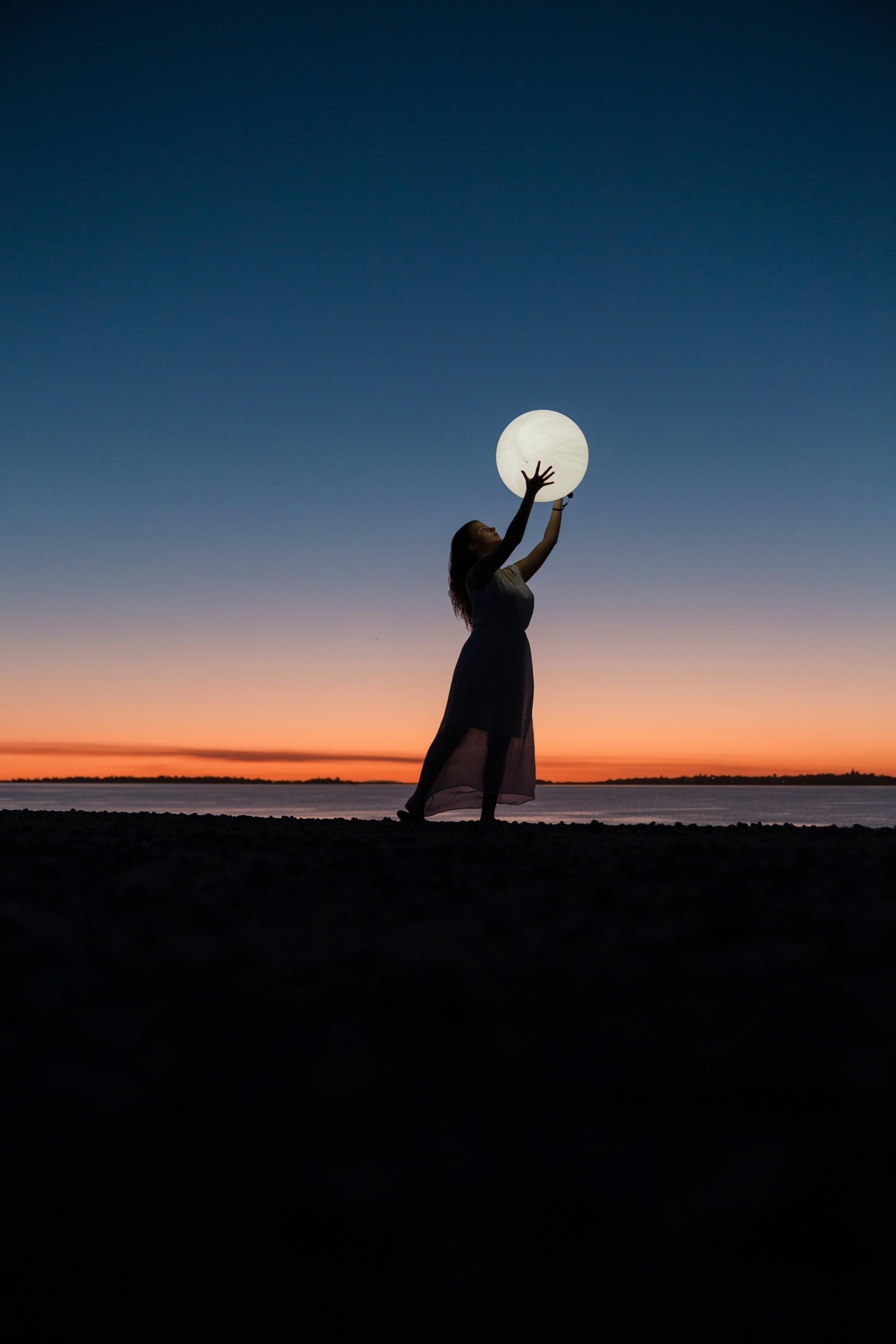 3648x5472 Woman Holding a Moon · Free