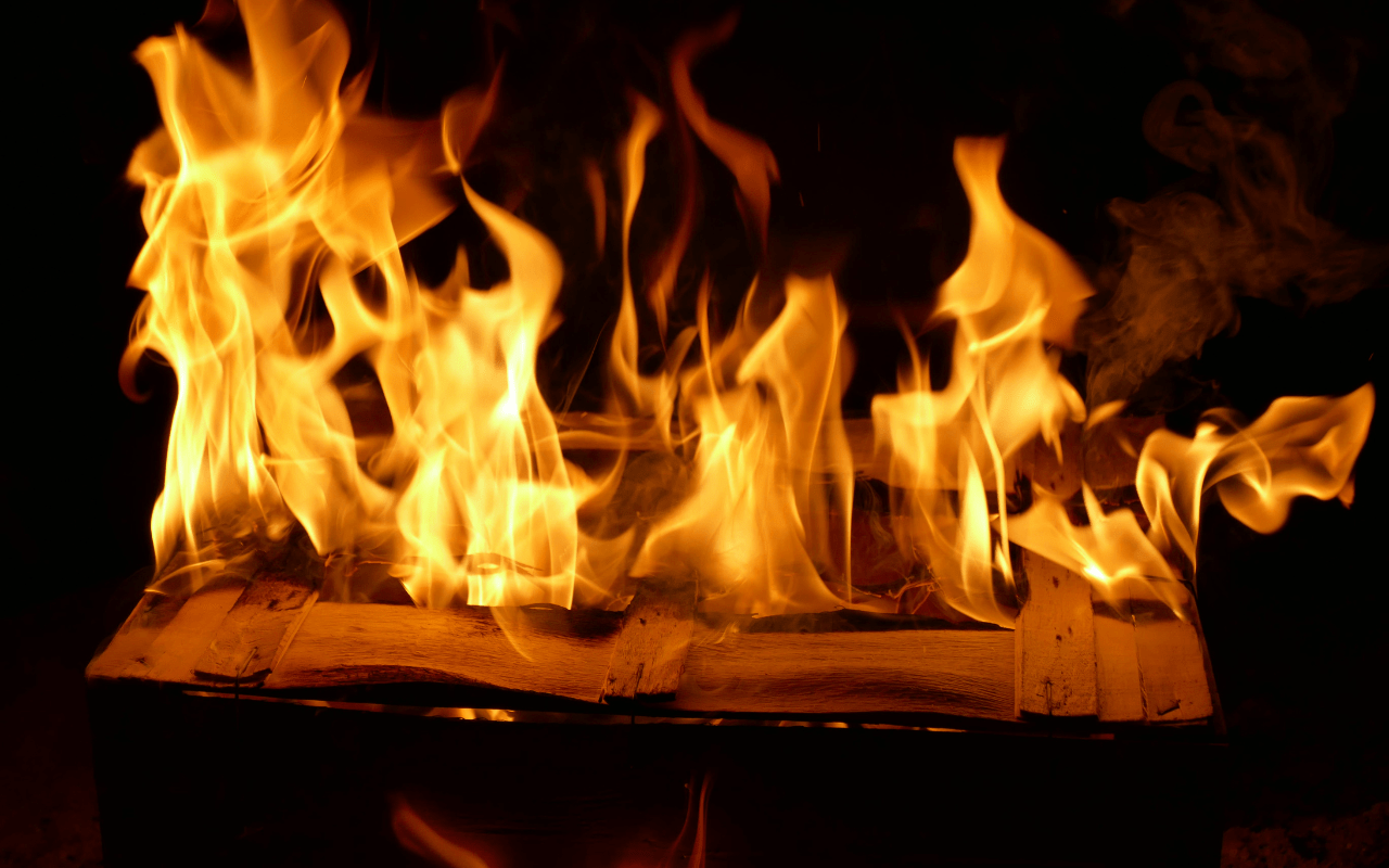 1280x800 A fire is burning in a box with a book Web Store