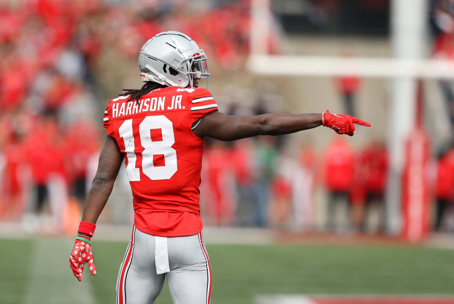 1486x995 Download Football Player Harrison Jr Pointing On Field Wallpaper