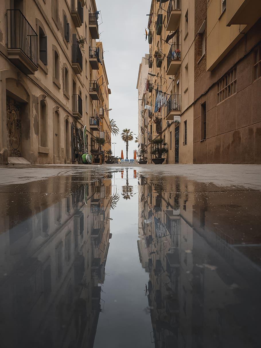910x1213 HD wallpaper: puddle, street, urban, spain, road, city, town, building, barcelona