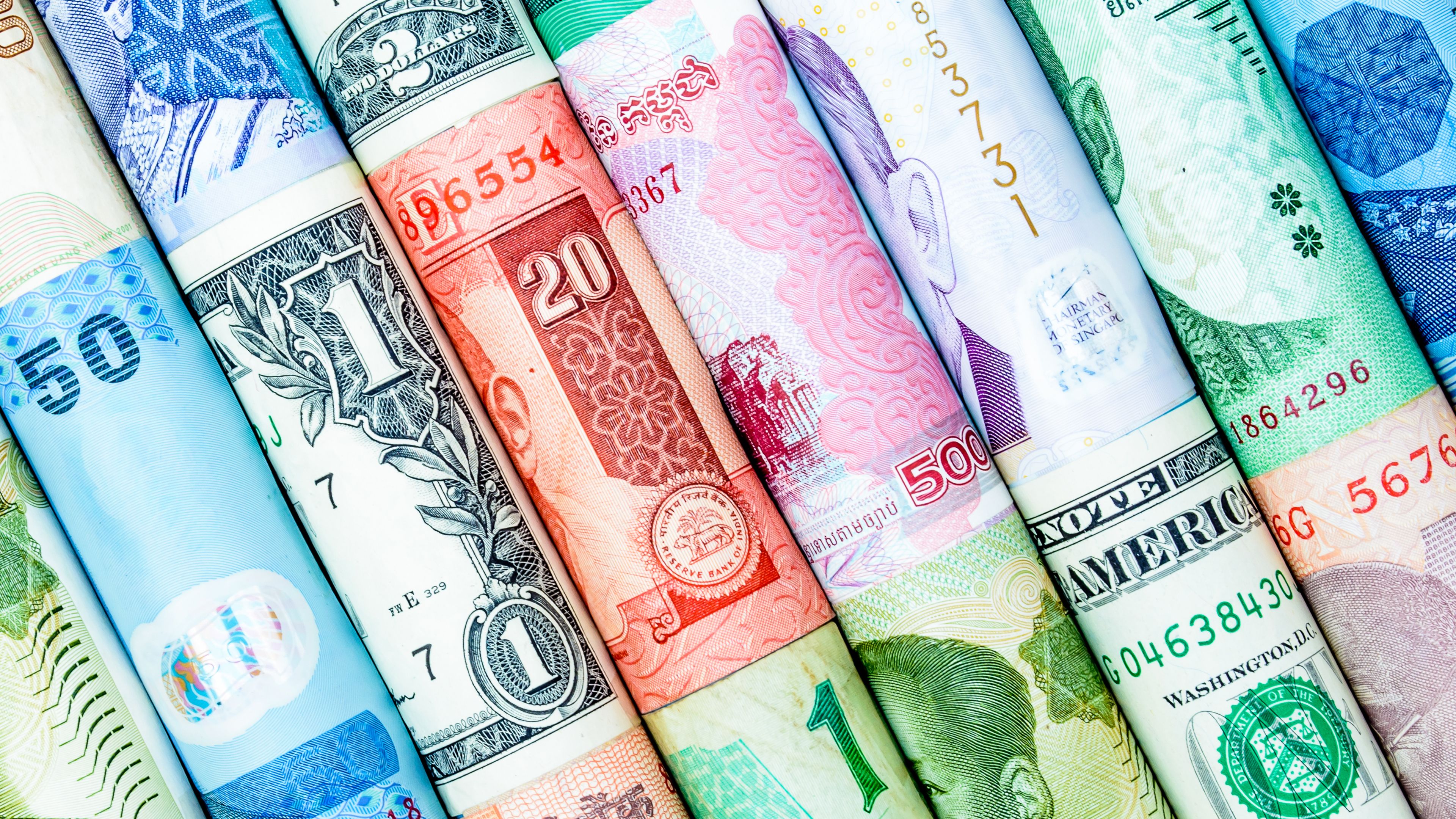 3840x2160 Rolls Of Different Country Currencies 4K HD Money Wallpaper