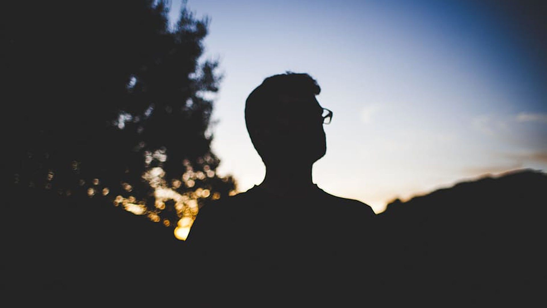 1920x1080 Sad Man Is Standing In Sunset Silhouette Background HD Sad Wallpaper
