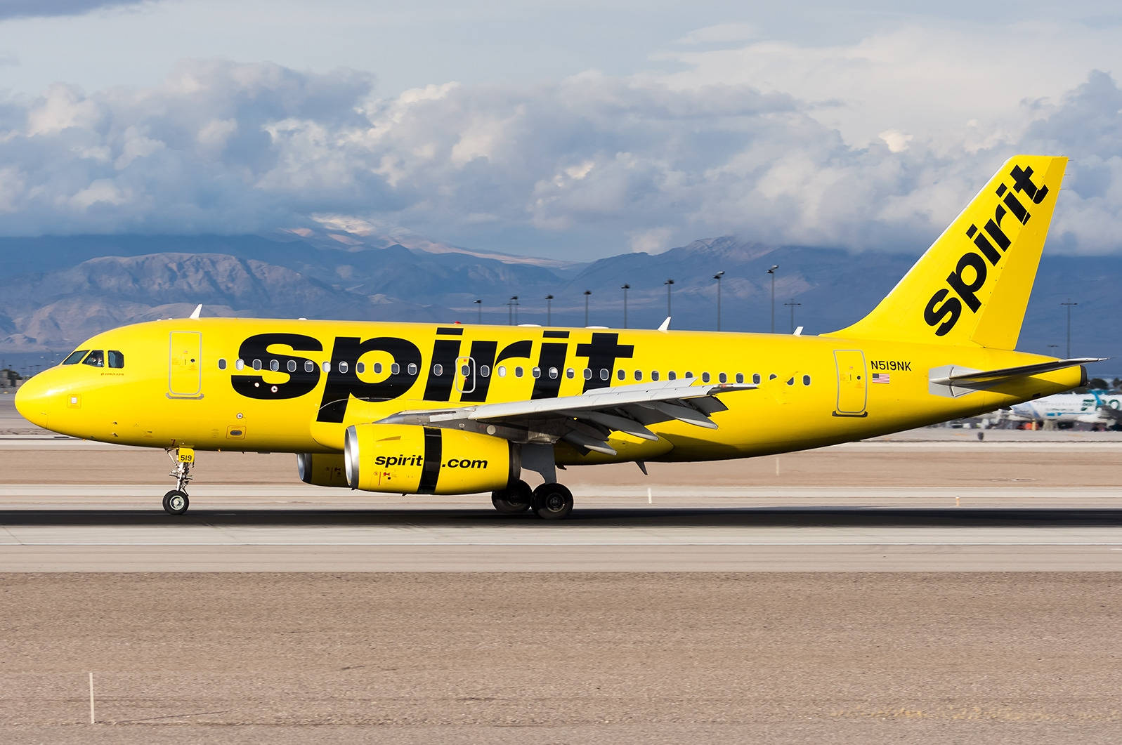 1597x1061 Download Thick Clouds Spirit Airlines Plane Wallpaper