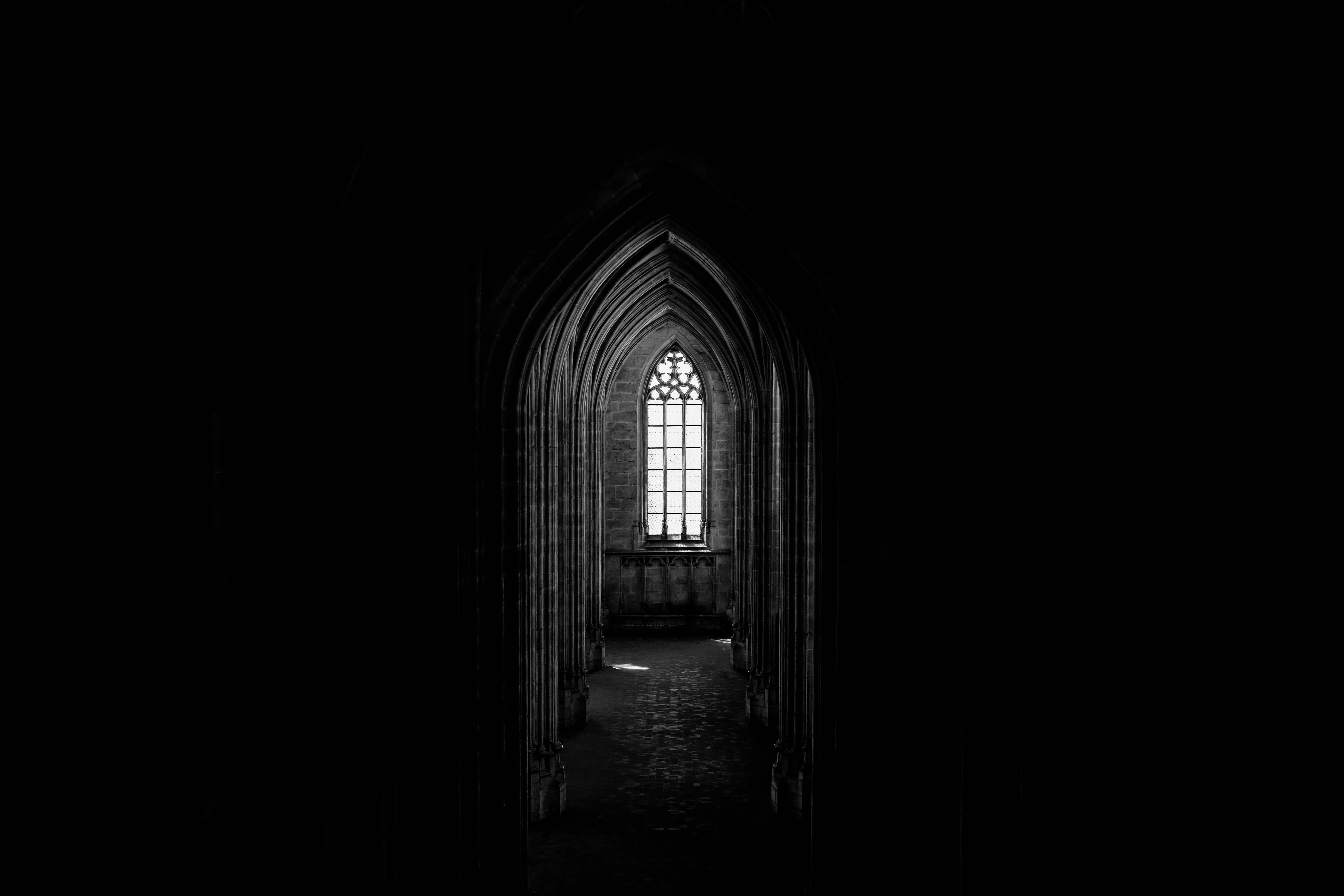 5923x3949 Browse Free HD Image of A Gothic Church Window Illuminates A Corridor Of Archways