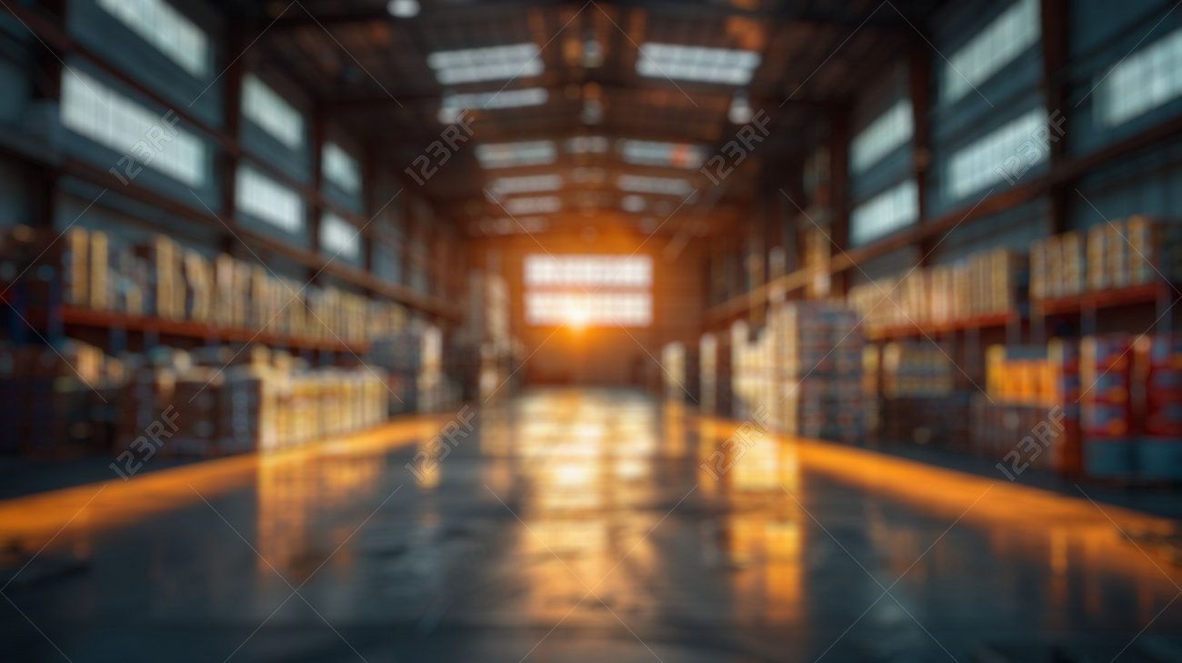 1300x729 Blur Background Of Spacious Industrial Warehouse Interior With High Ceilings And Lighting. Interior Design Of Factory. Manufacturing And Storage Facility. Design For Poster, Wallpaper, Banner. Spate. , Picture and Royalty Free