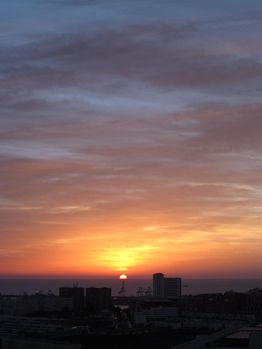 910x1213 HD wallpaper: gran canaria, dawn, horizon, city, sun, cranes