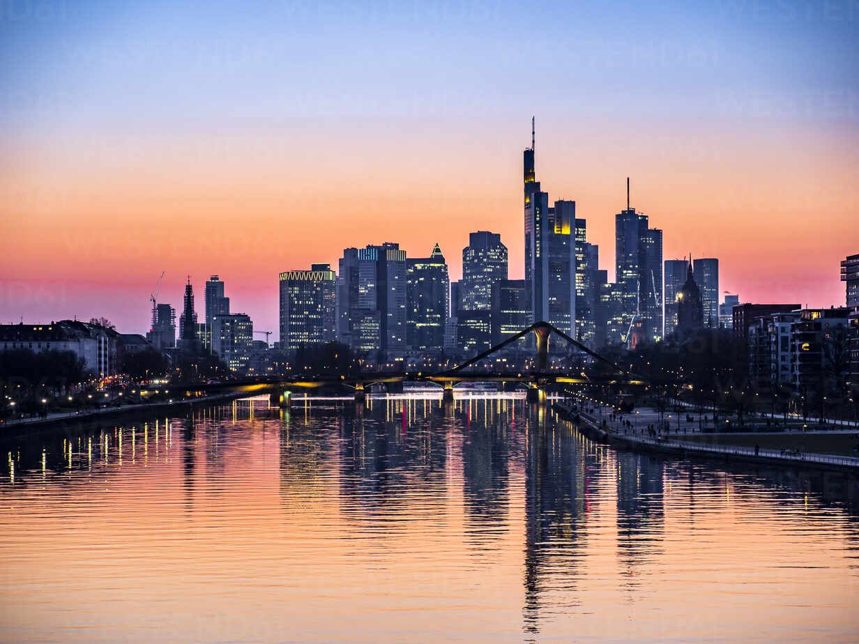 1232x924 Germany, Hesse, Frankfurt, River Main canal at dusk with bridge and downtown skyscrapers in background