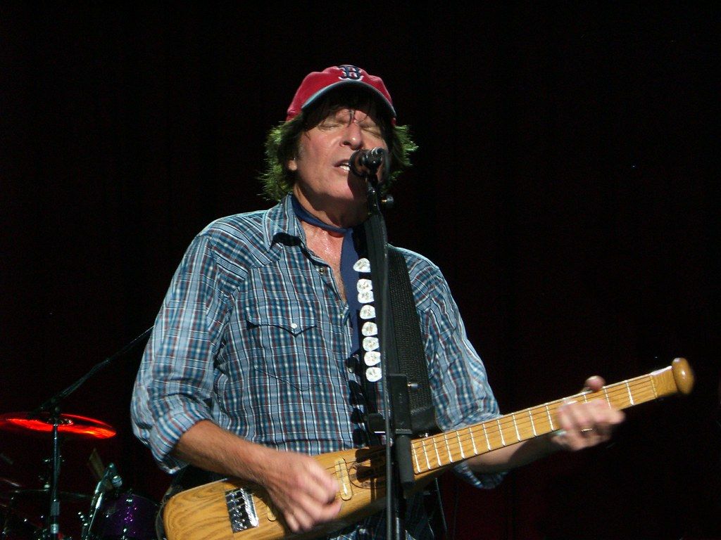 1024x768 John Fogerty. With his custom baseball bat gu