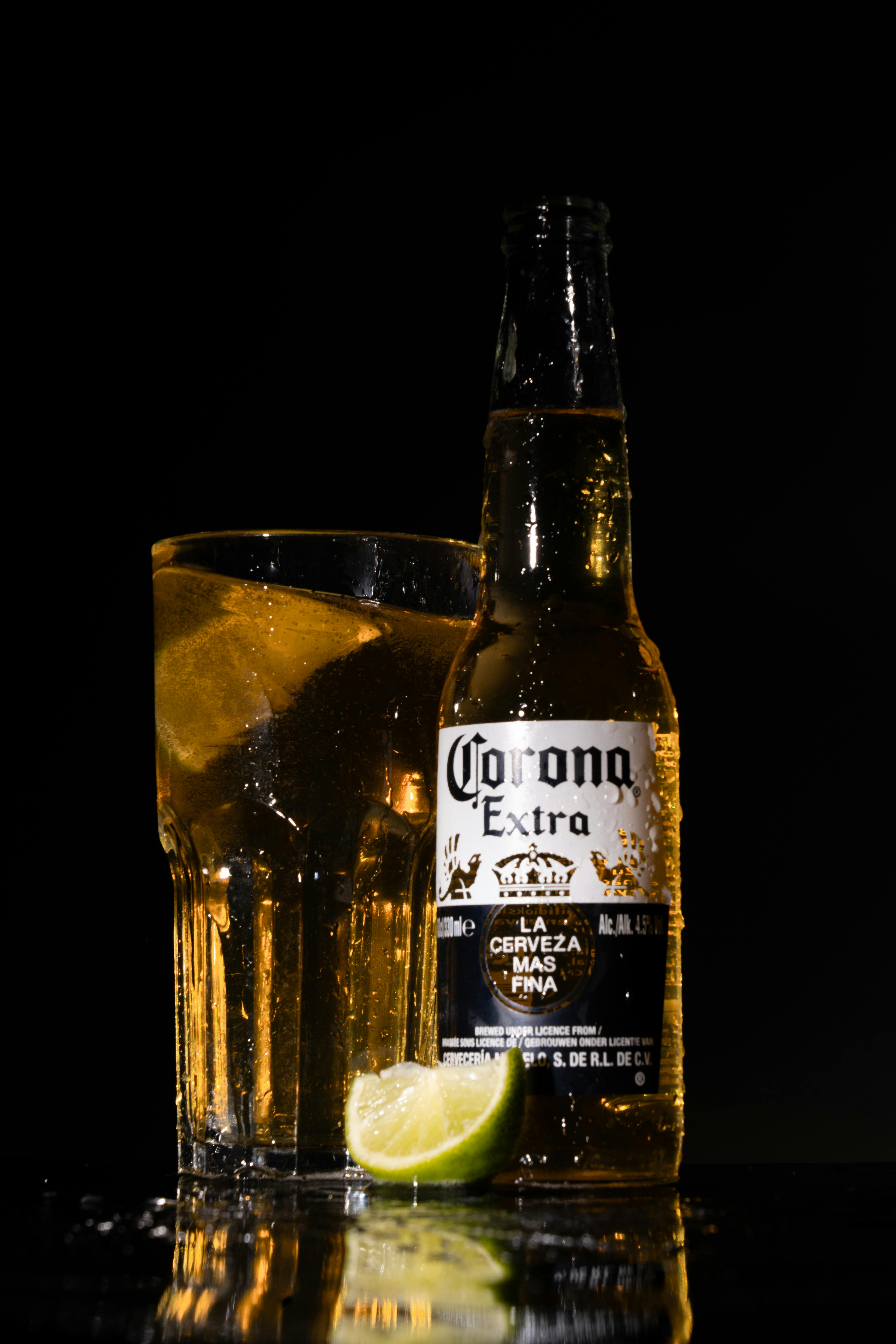 5304x7952 Corona Extra and Glass of Beer Against Black Background · Free