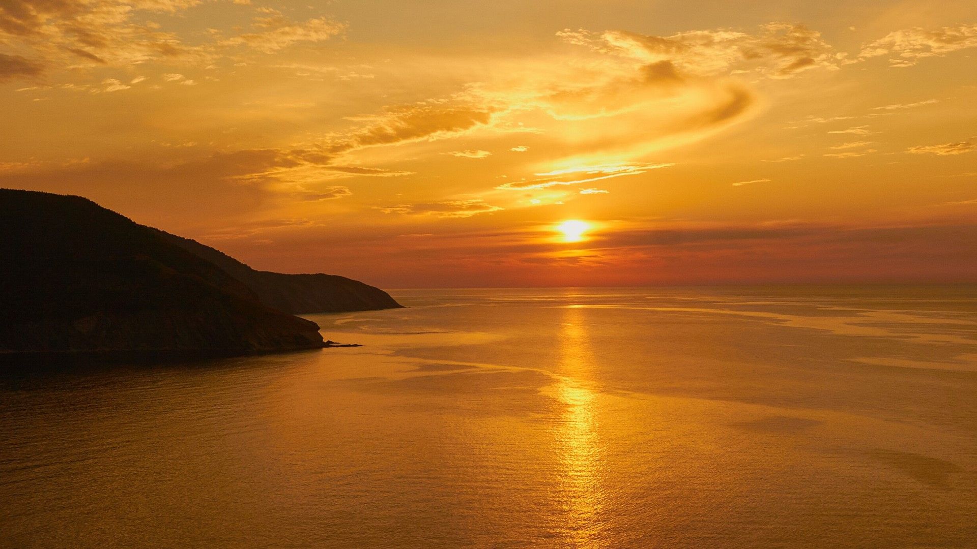 1920x1080 Sunset over the coast of Cape Breton Island, Nova Scotia, Canada. Windows Spotlight Image