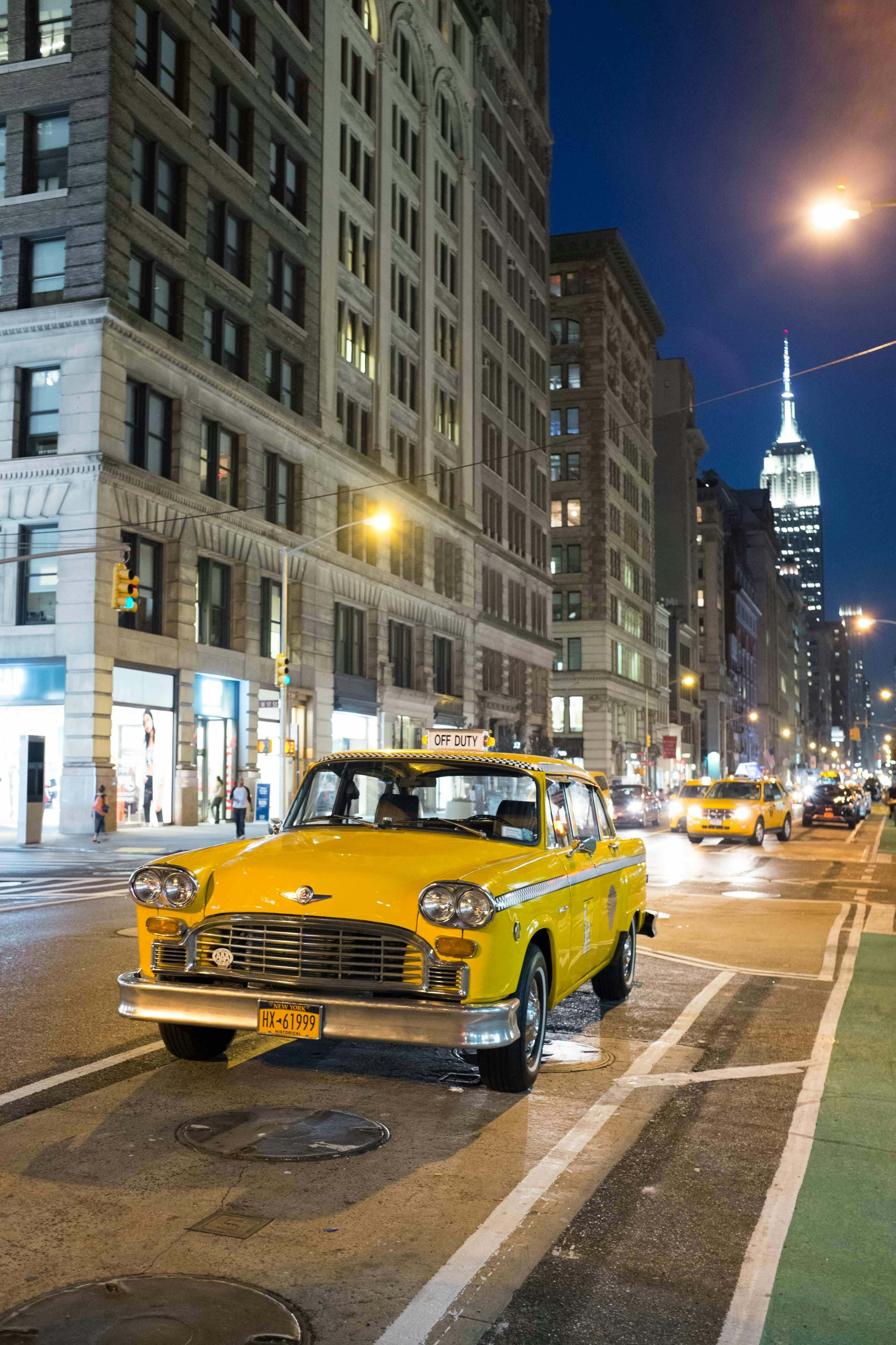 3264x4896 A Parked Yellow Taxi on the Road · Free
