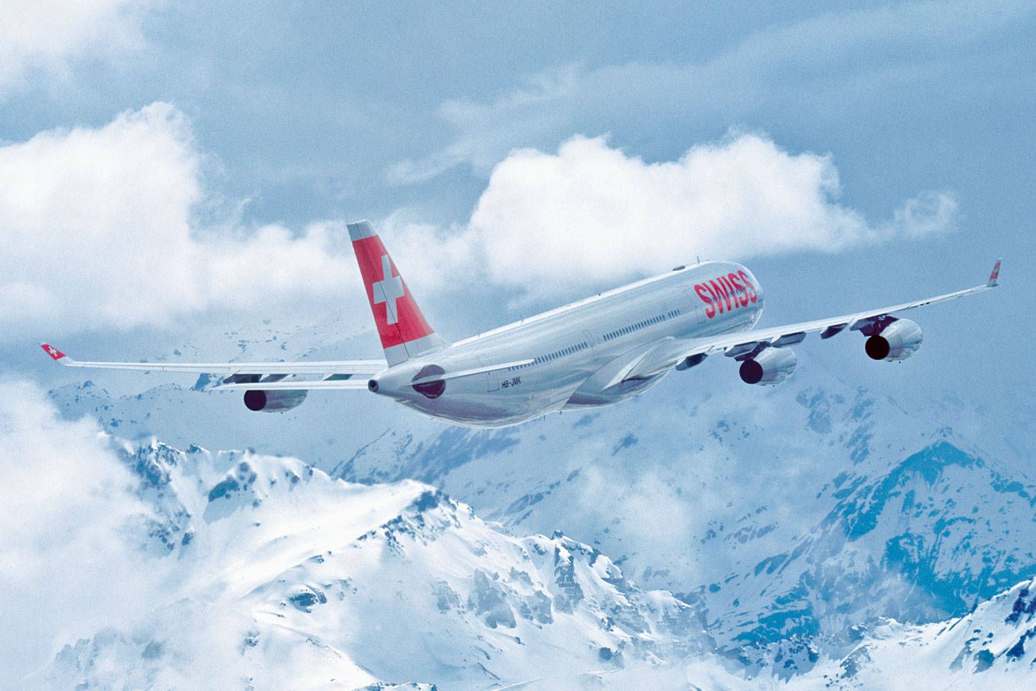 1500x1000 Download Swiss Airlines Airplane On A Cloudy Mountain Wallpaper
