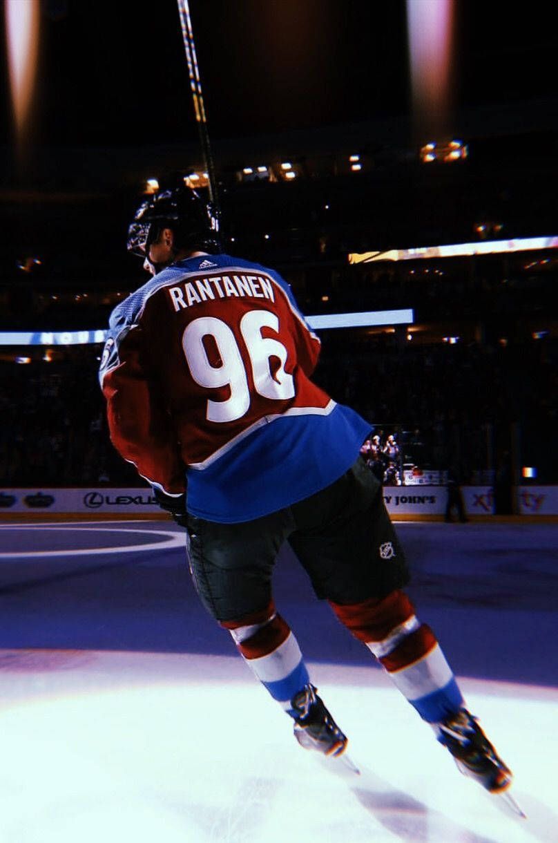 808x1220 Download Back Shot Of Mikko Rantanen Leaning To The Left Under The Spotlight Wallpaper