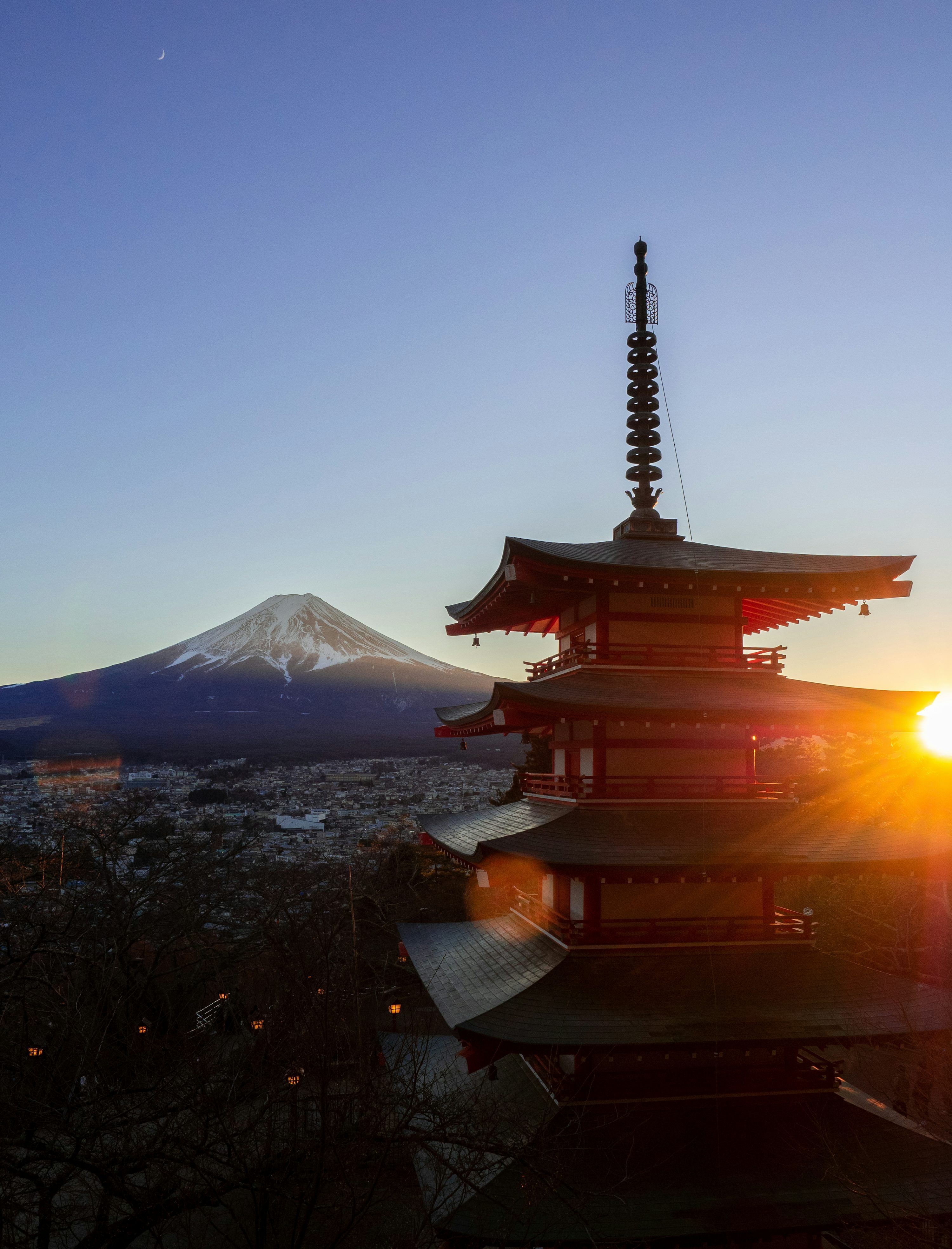 3000x3935 A tall pagoda with a mountain in the background photo