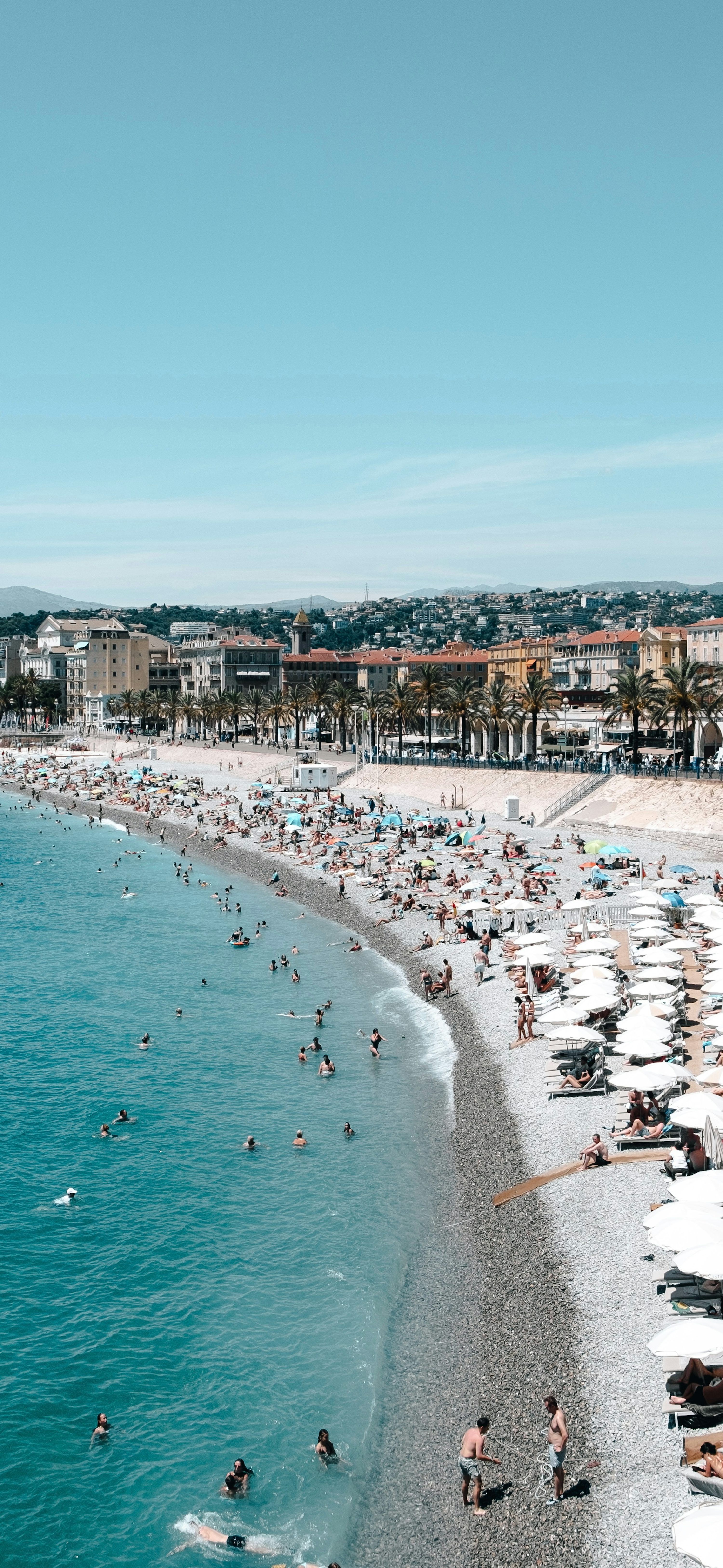 3000x6504 Crowd of people on seashore during daytime photo