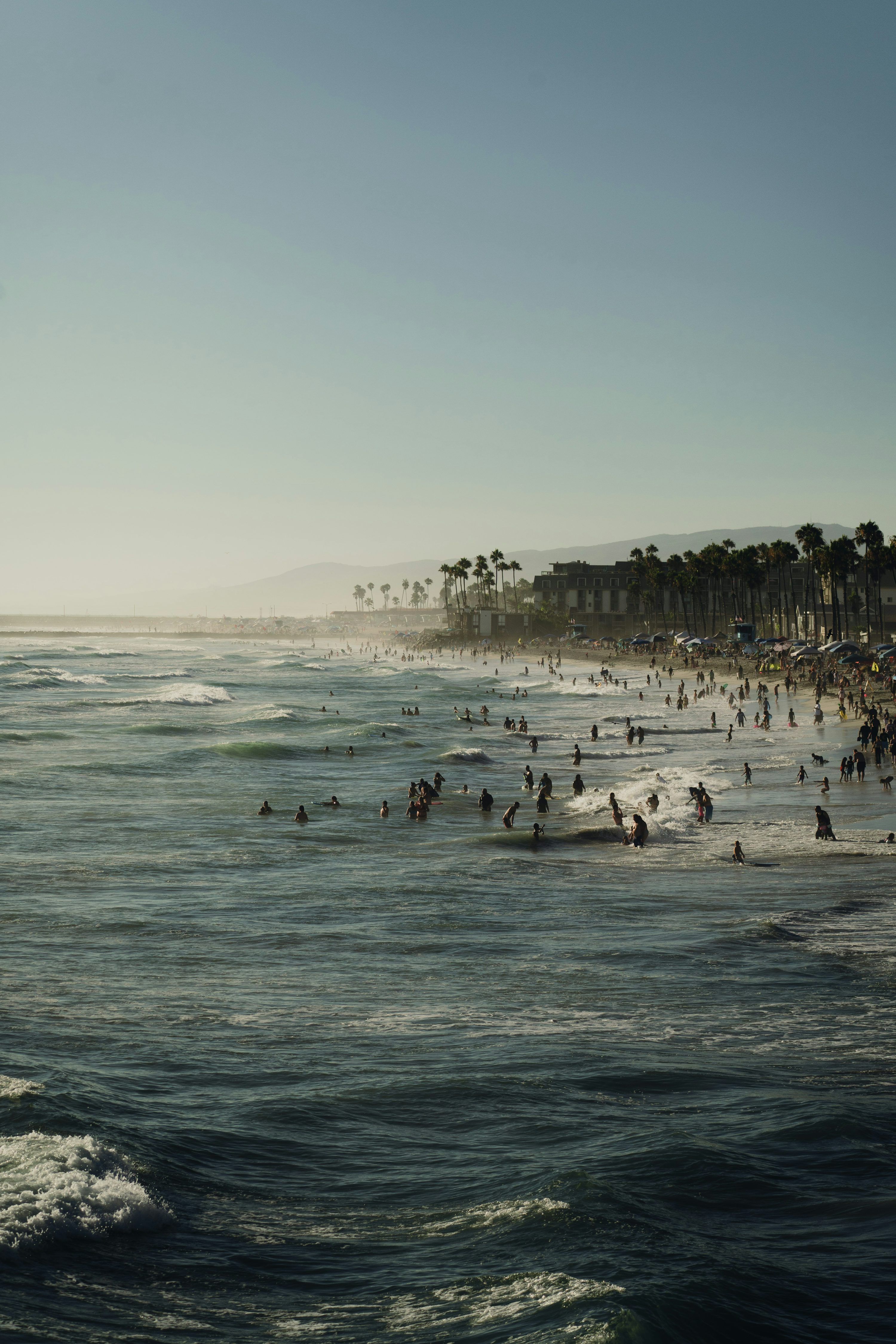 3000x4500 A group of people swimming in the ocean photo