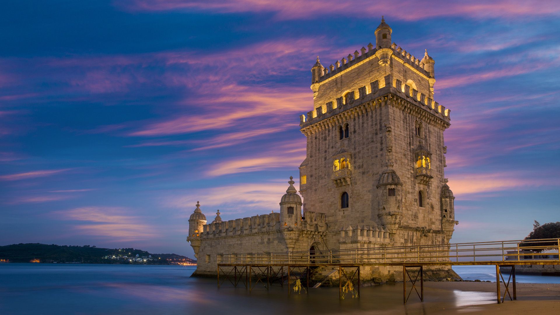 1920x1080 The illuminated Belém Tower on Tagus river at dusk, Lisbon, Portugal. Windows Spotlight Image