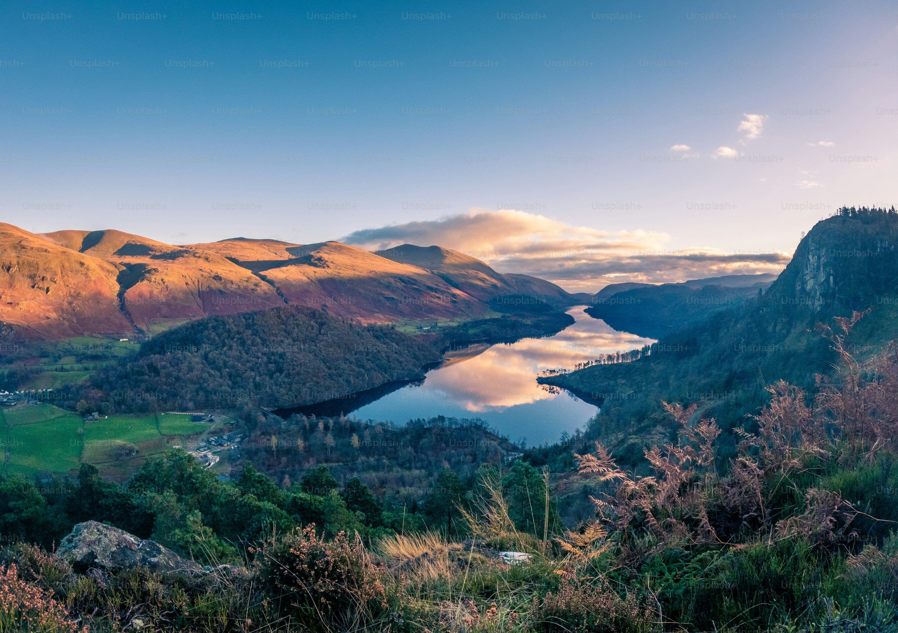 3000x2116 A scenic view of a lake surrounded