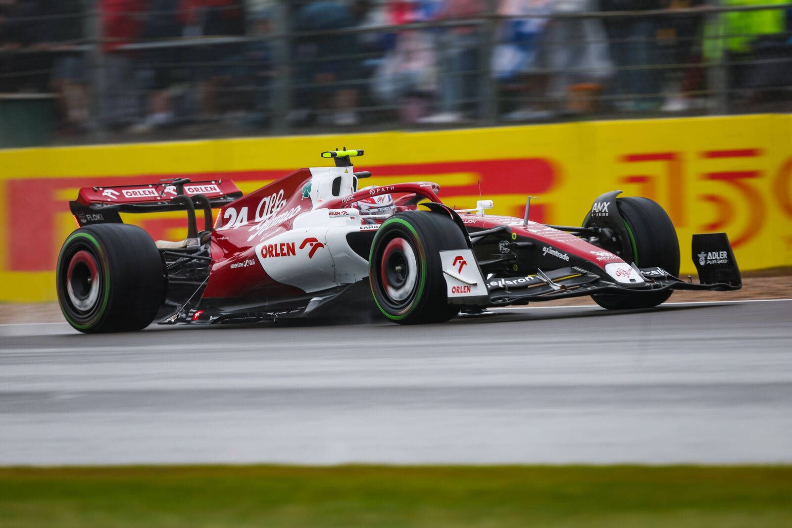 1600x1067 Download Guanyu Zhou F1 Red Race Car Wallpaper