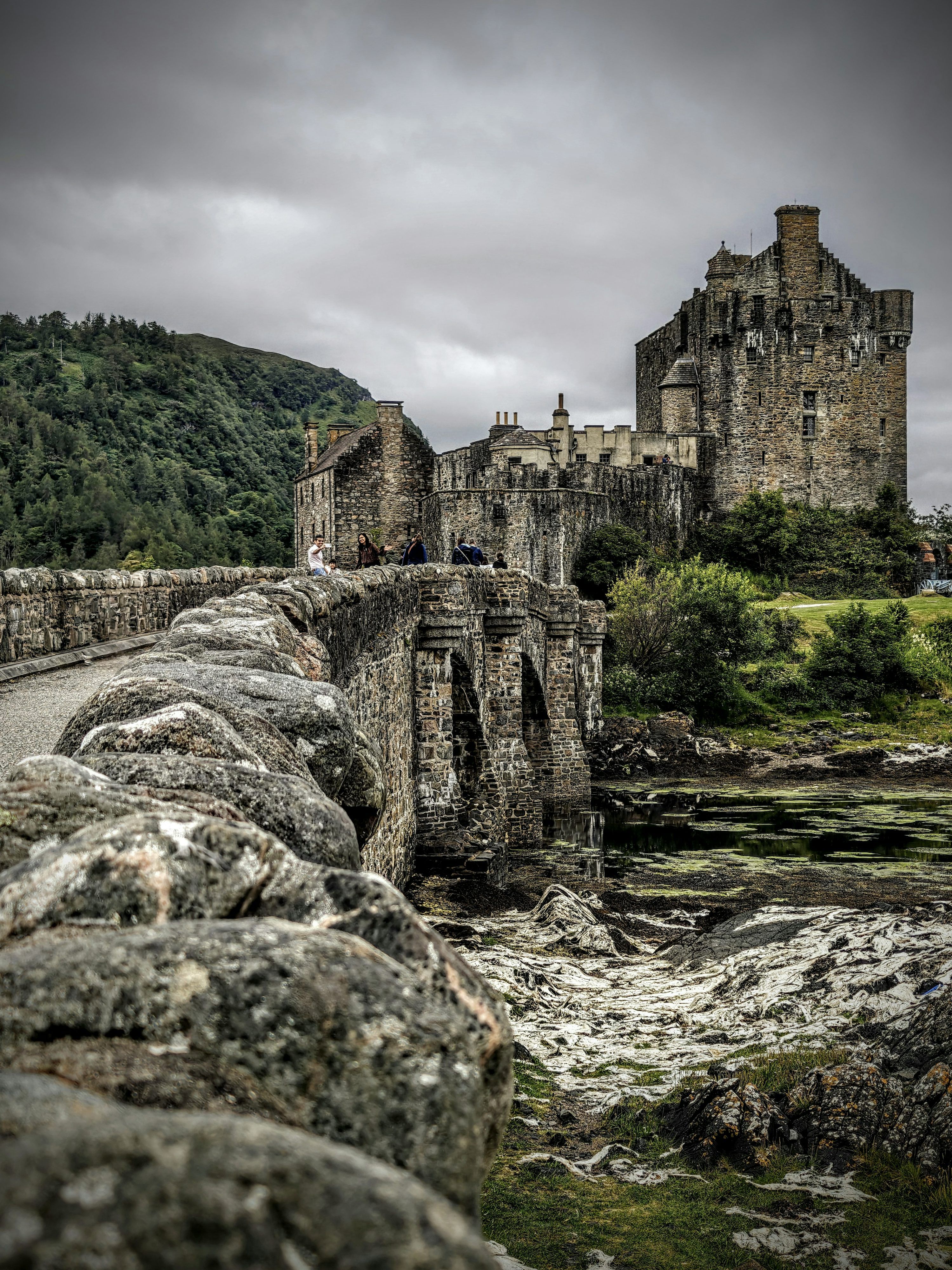 3000x4000 A stone bridge with a castle in the background photo