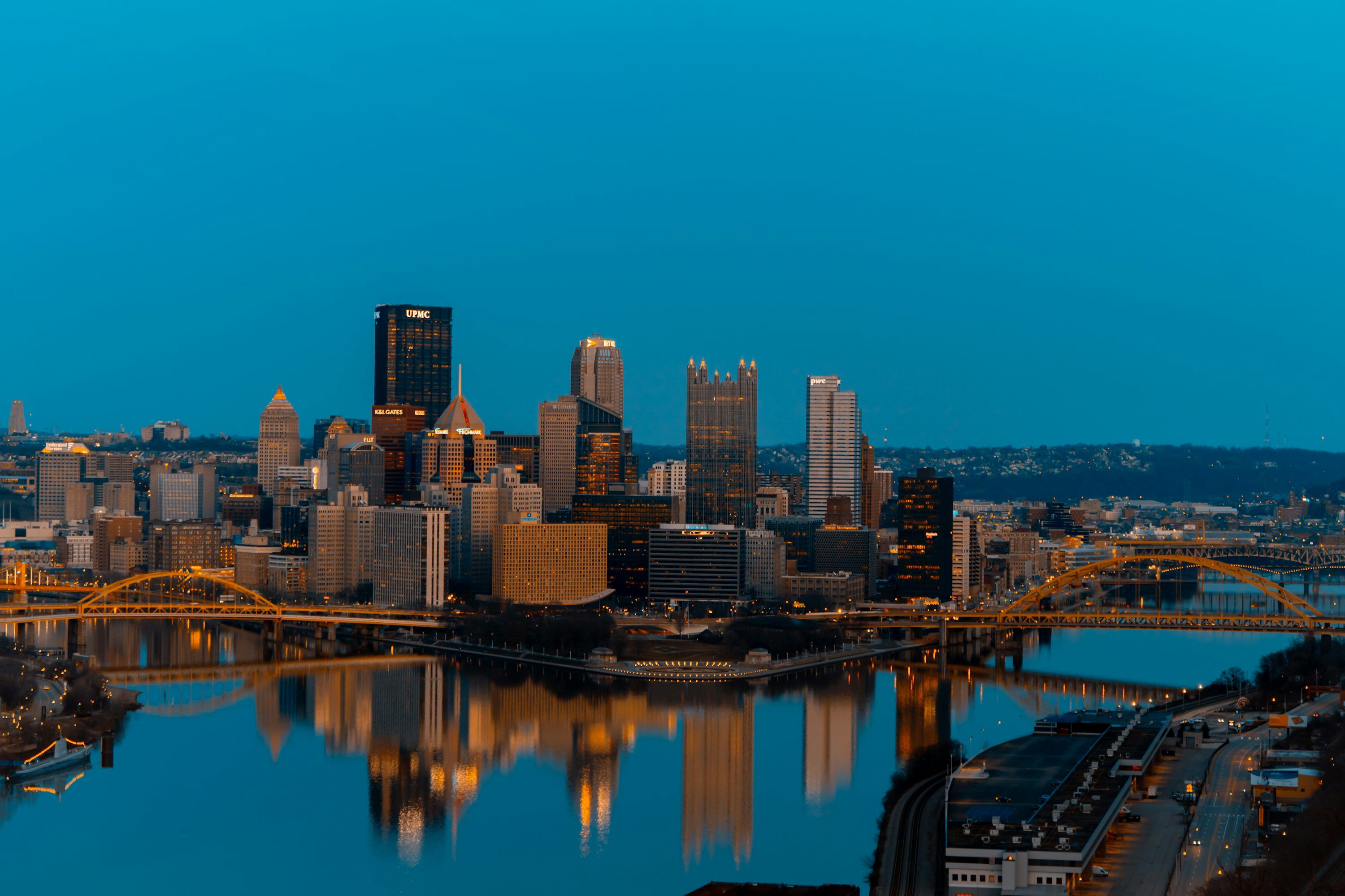 3000x2000 A view of a city at night from across the river photo
