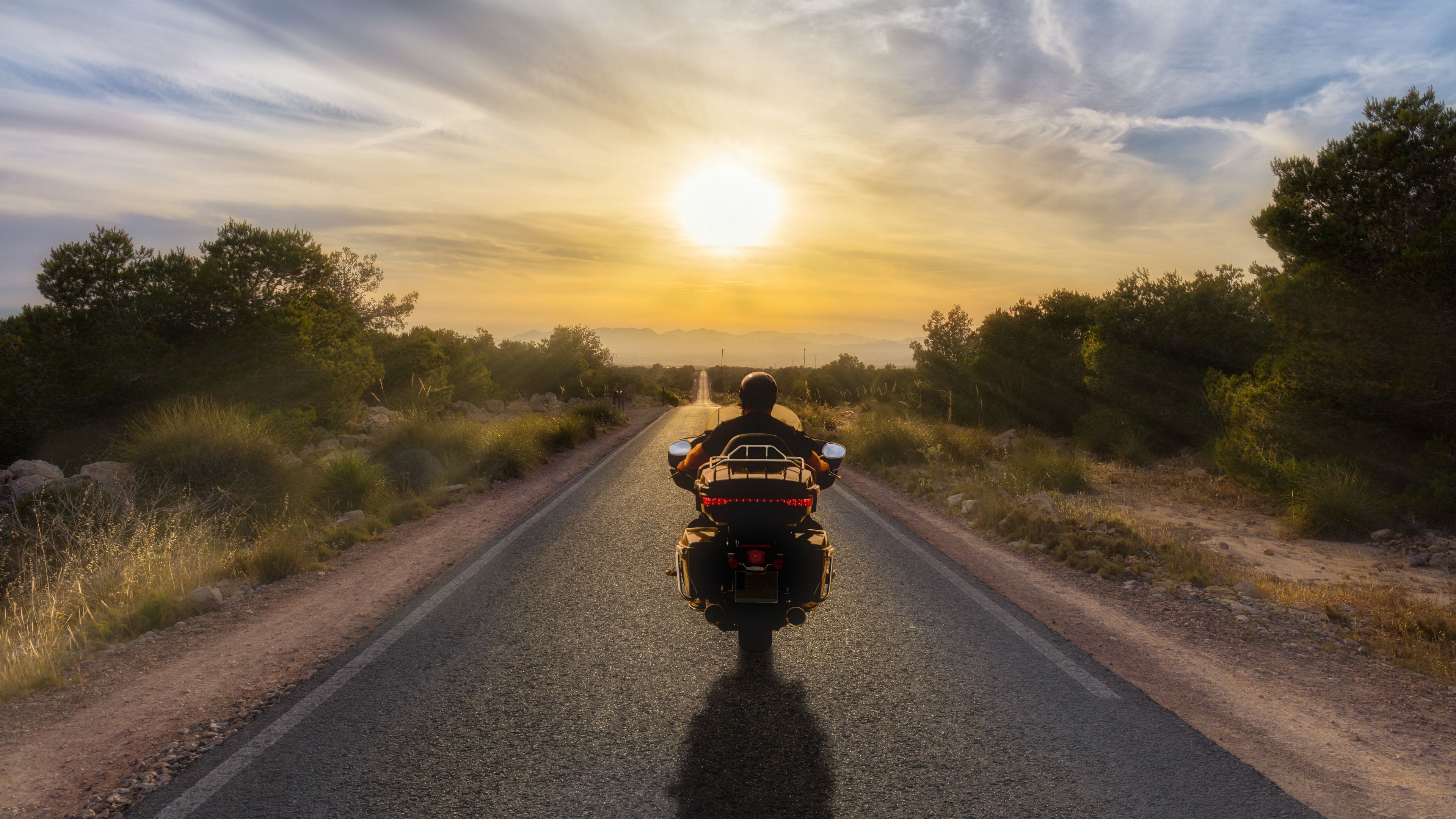 3840x2160 Download wallpaper 3840x2160 motorcycle, bike, biker, motorcyclist, road, sunset 4k uhd 16:9 HD background