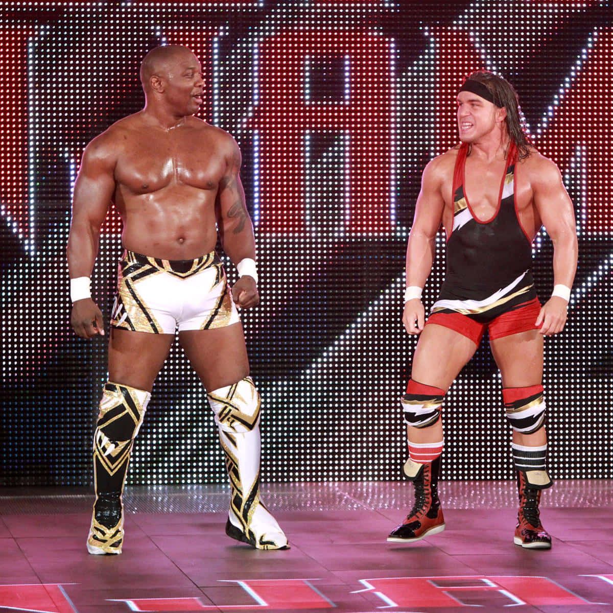 1200x1200 Download Caption: Wrestling Champions Benjamin and Chad Gable against The Ascension Wallpaper