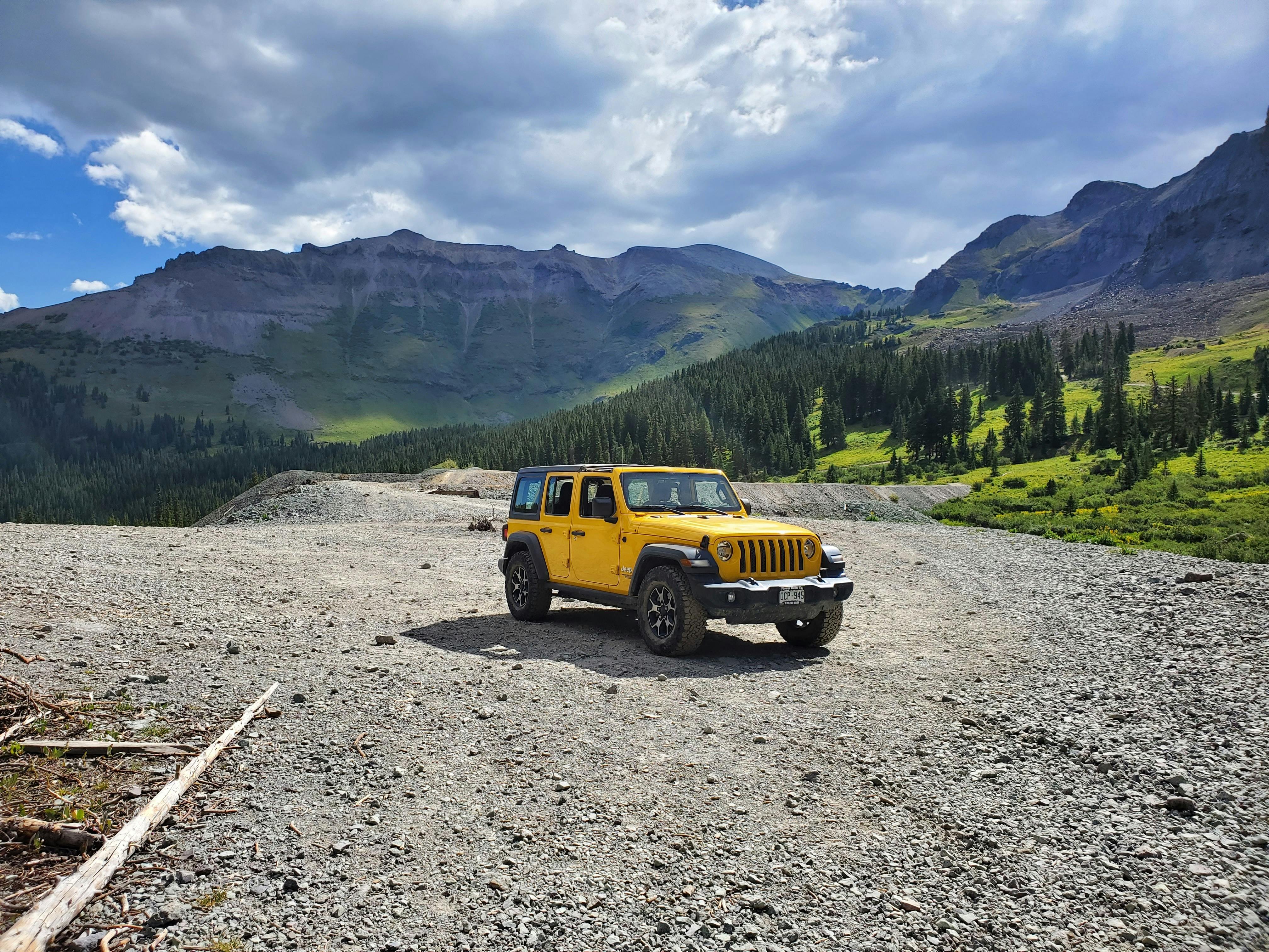 4032x3024 View of a Yellow Jeep Wrangles Parked in Mountains · Free