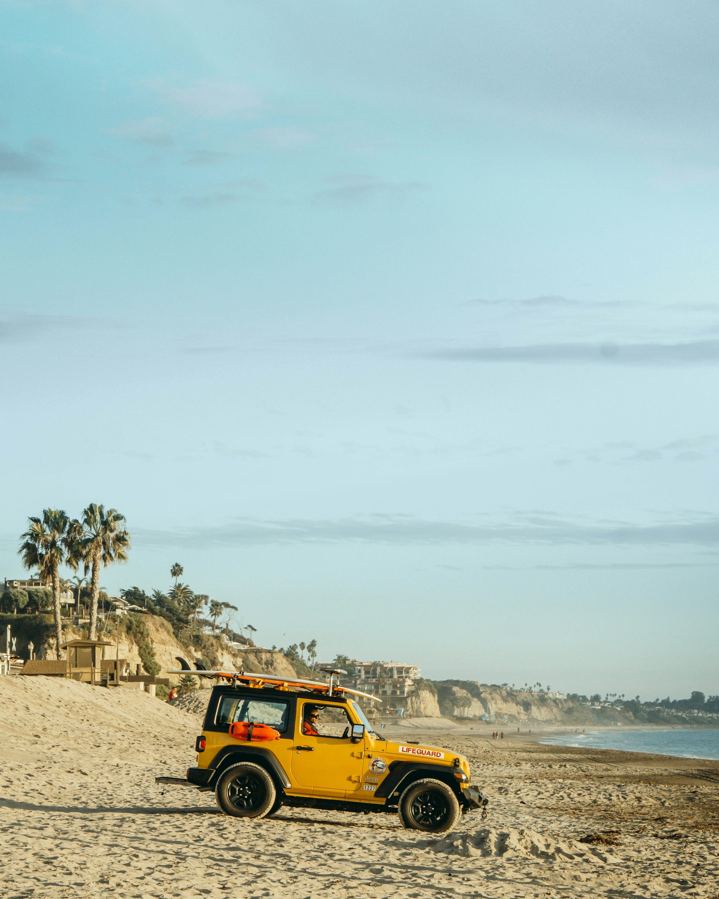 3000x3750 Yellow jeep wrangler on beach during daytime photo