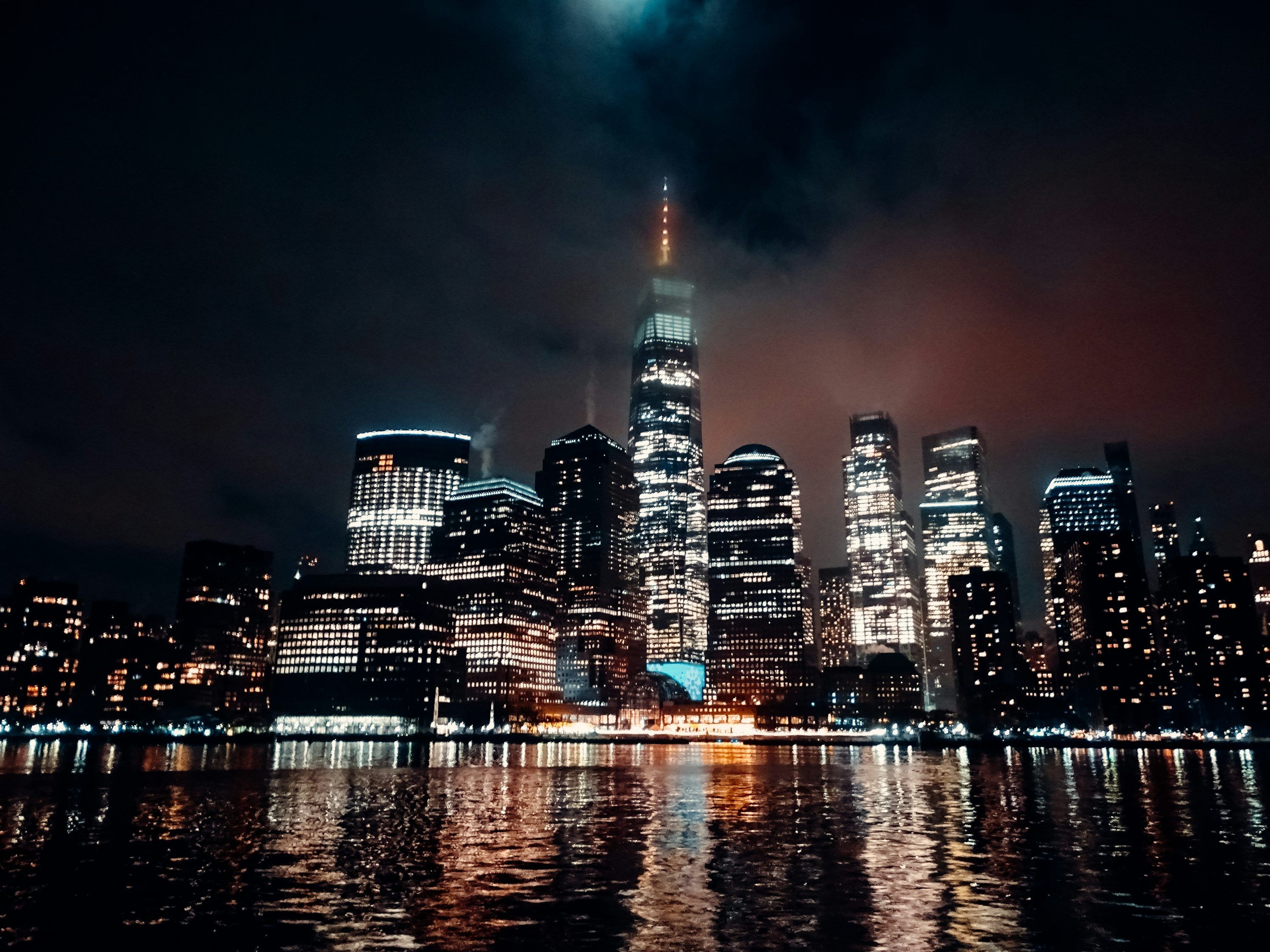 3000x2250 A city at night with a full moon in the sky photo
