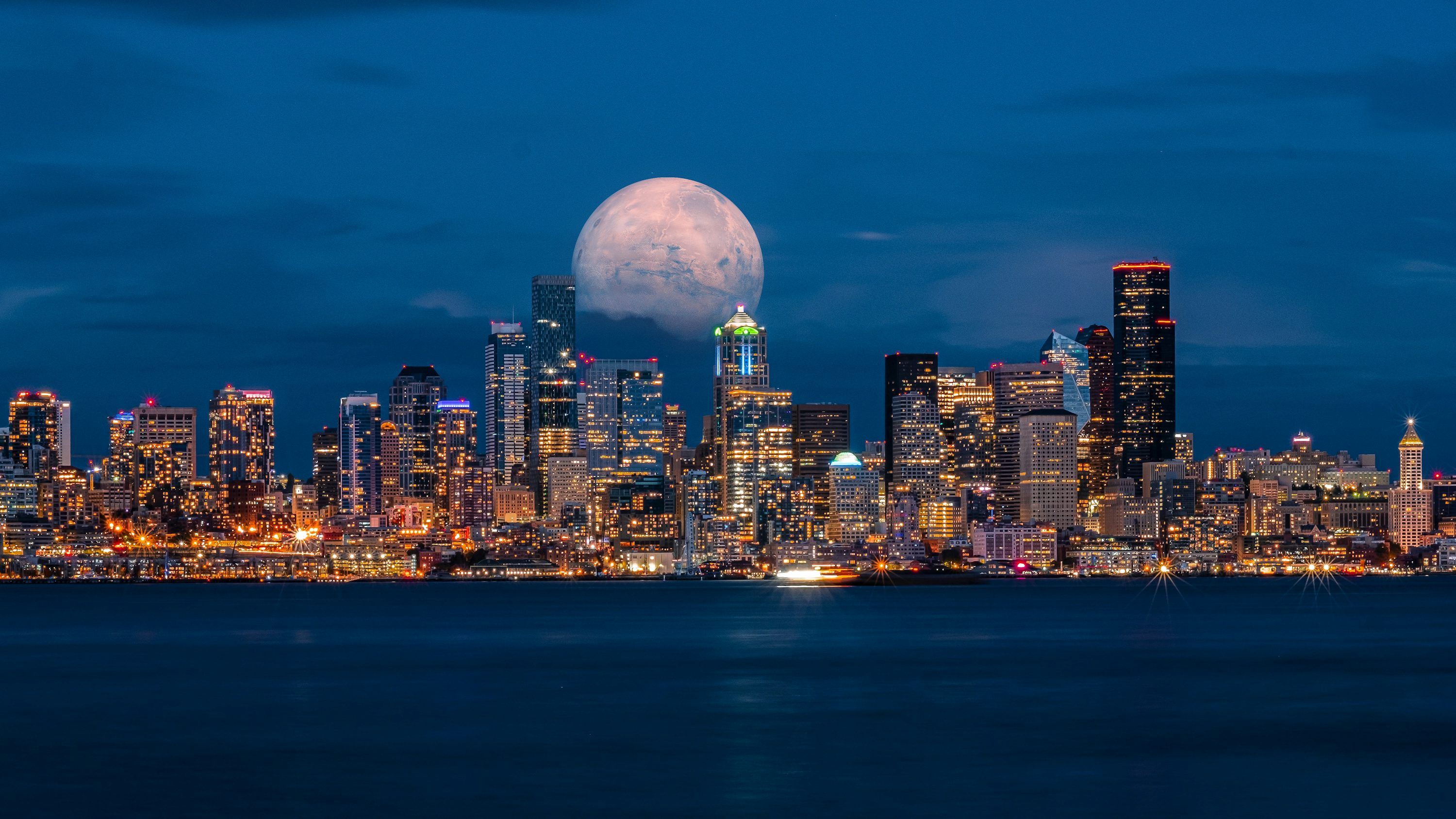 3000x1687 City skyline during night time photo