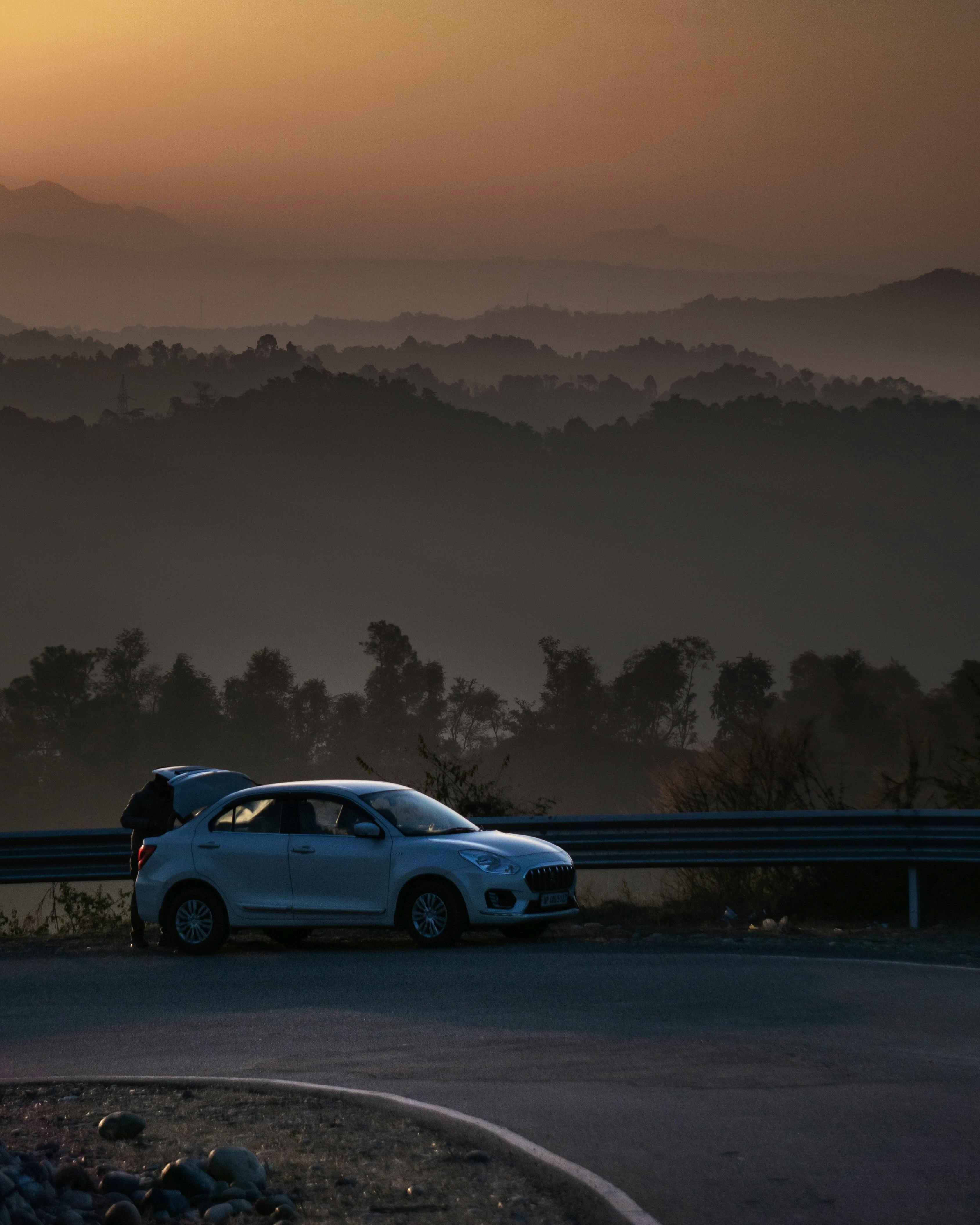3376x4220 Suzuki Dzire on Road Curve at Dusk · Free
