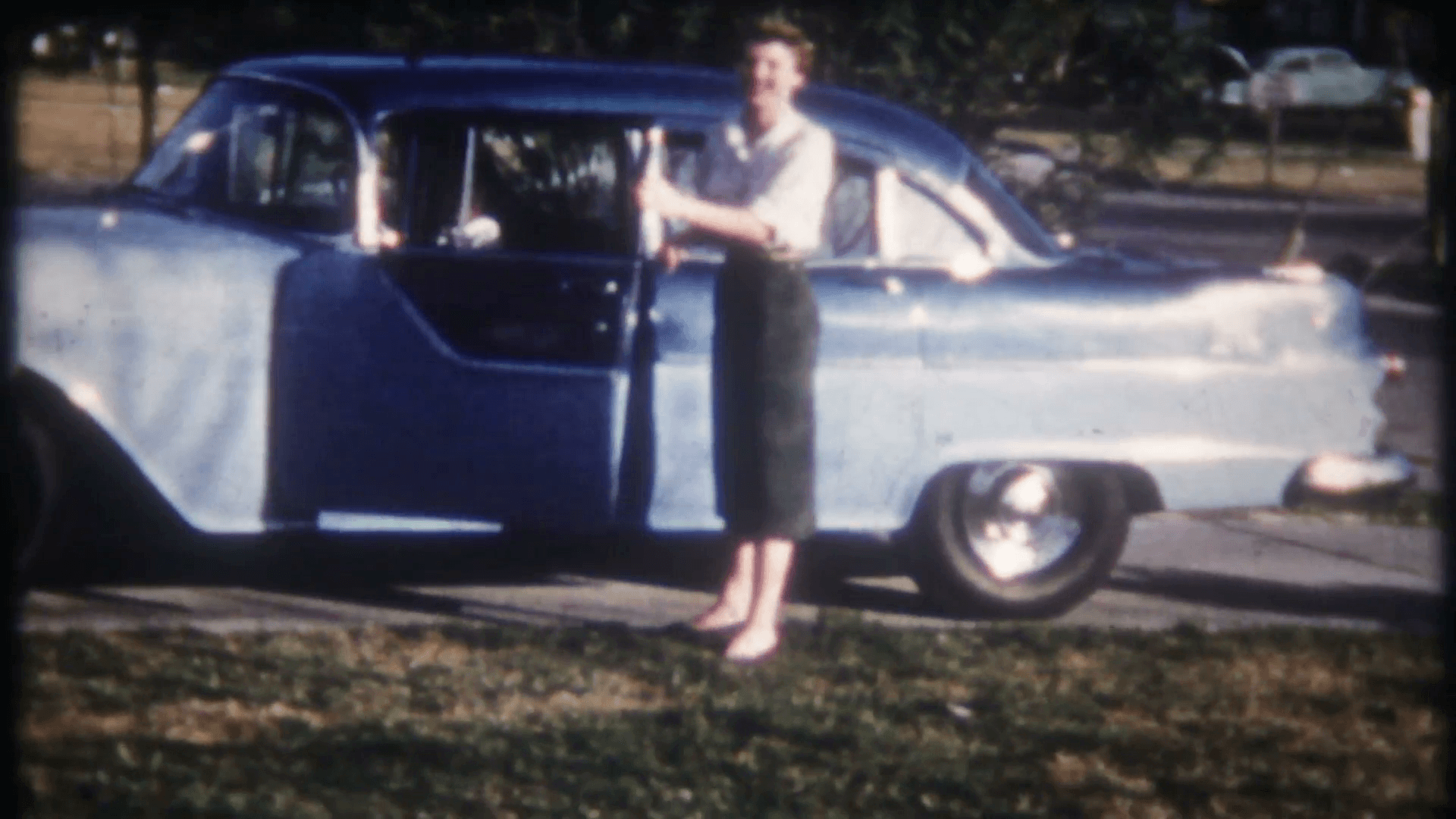 1920x1080 mom & daughter drive into the driveway in the new family car