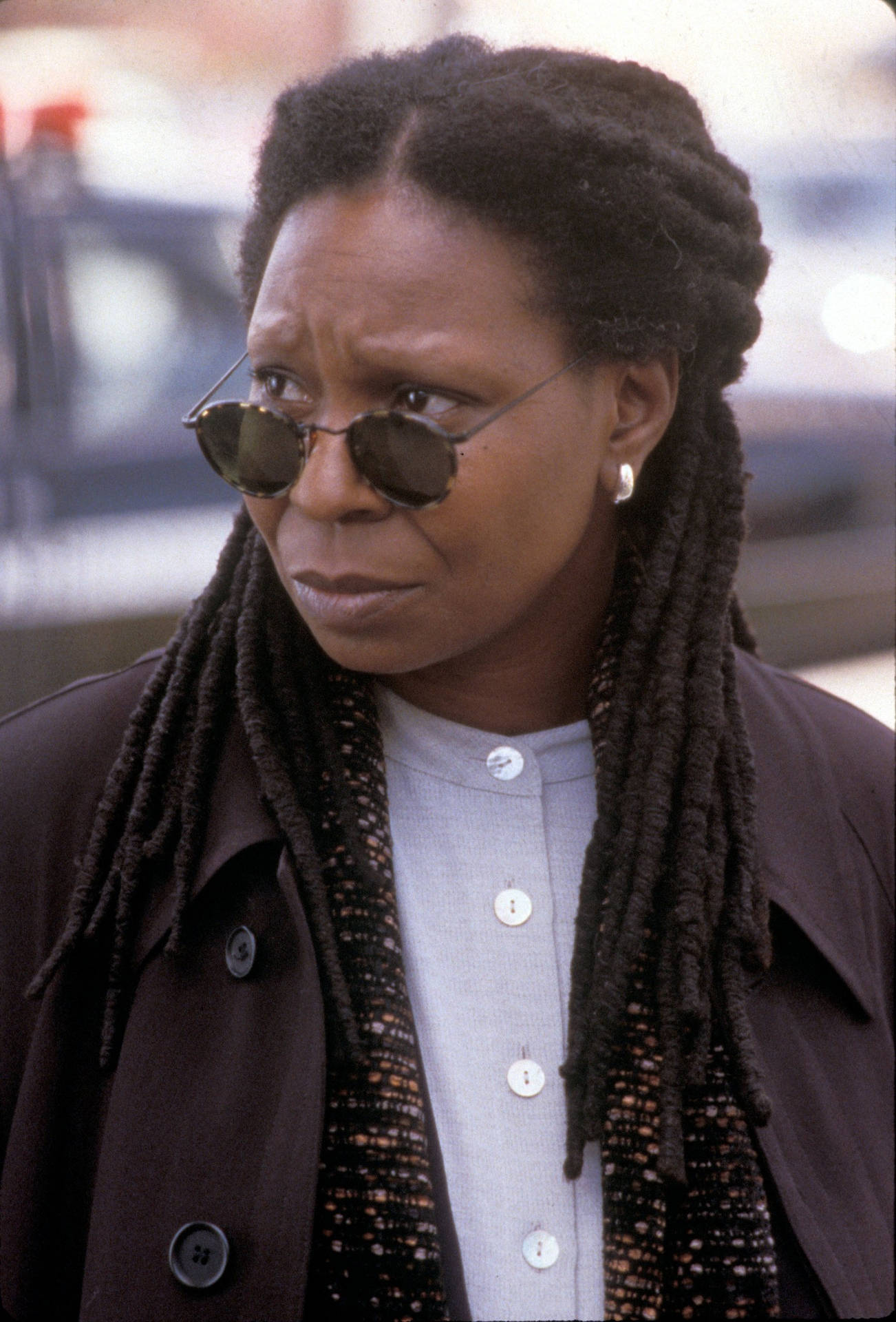 1302x1920 Download Whoopi Goldberg showcasing distinctive braided hairstyle Wallpaper