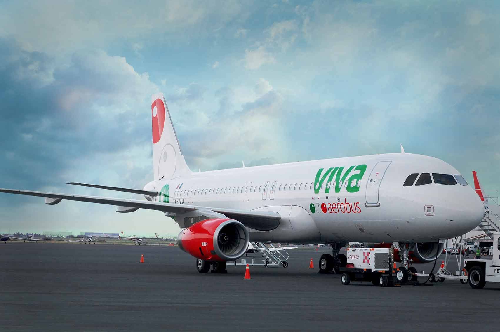 1700x1130 Download Viva Aerobus Parked Under Sky With Clouds Wallpaper