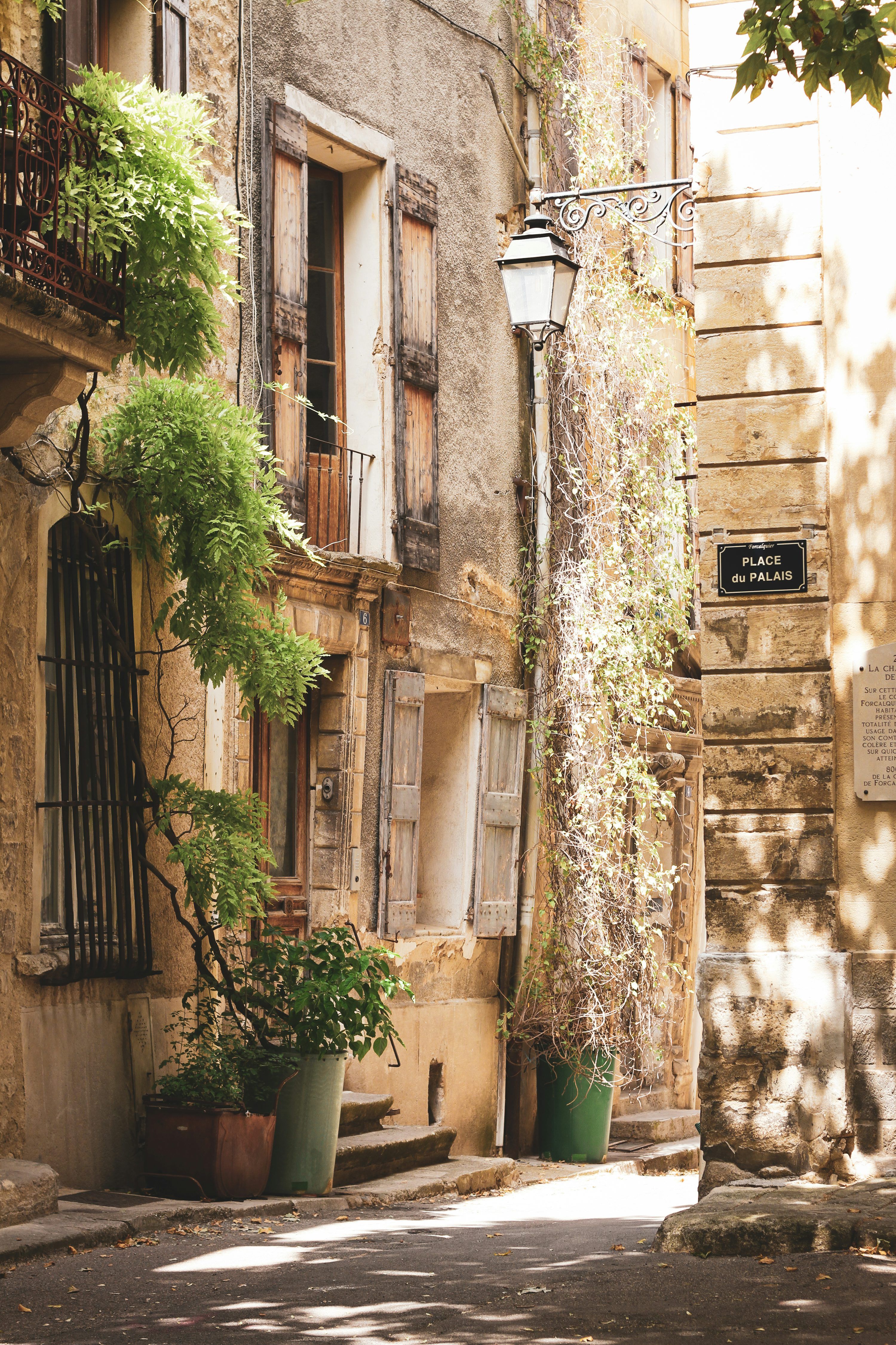 3000x4500 Charming european street with stone buildings and plants. photo