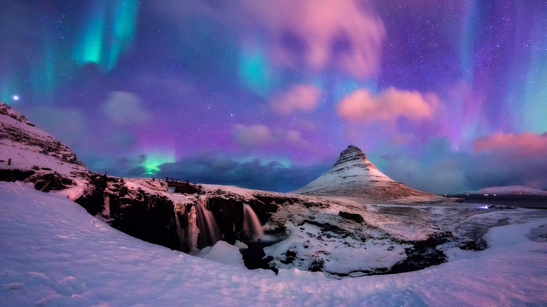 1920x1080 Aurora borealis or northern lights over Kirkjufell Mountain, Snæfellsnes peninsula, Iceland. Windows Spotlight Image