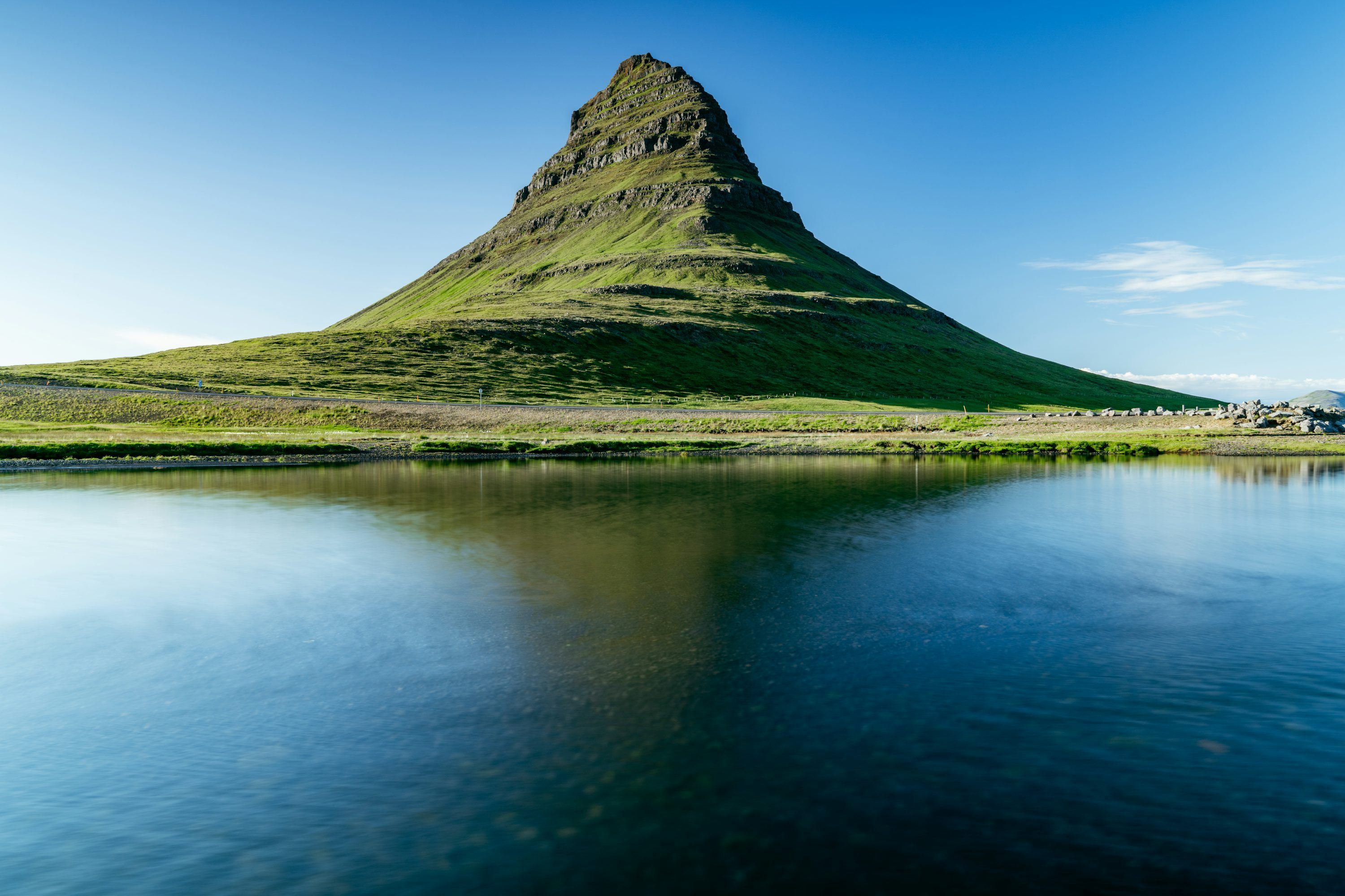 3000x2000 A mountain with a lake in front of it photo