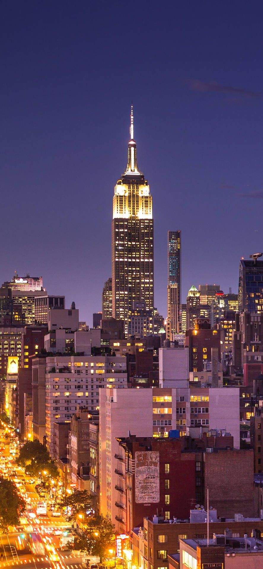 887x1920 Download A beautiful skyline of New York City on a crisp, sunny day. Wallpaper