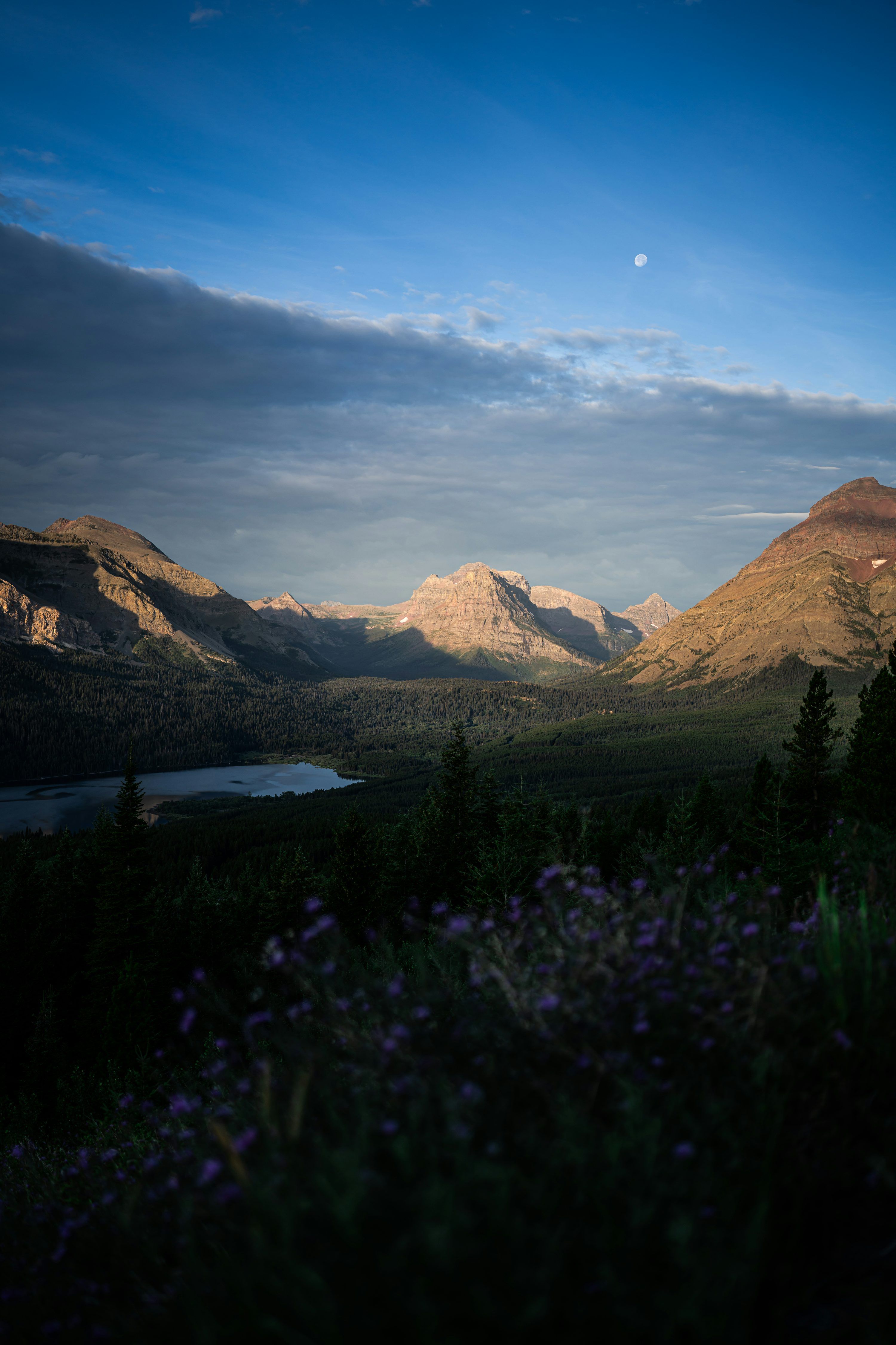 3000x4500 Sunlit mountains and valley under a twilight sky photo
