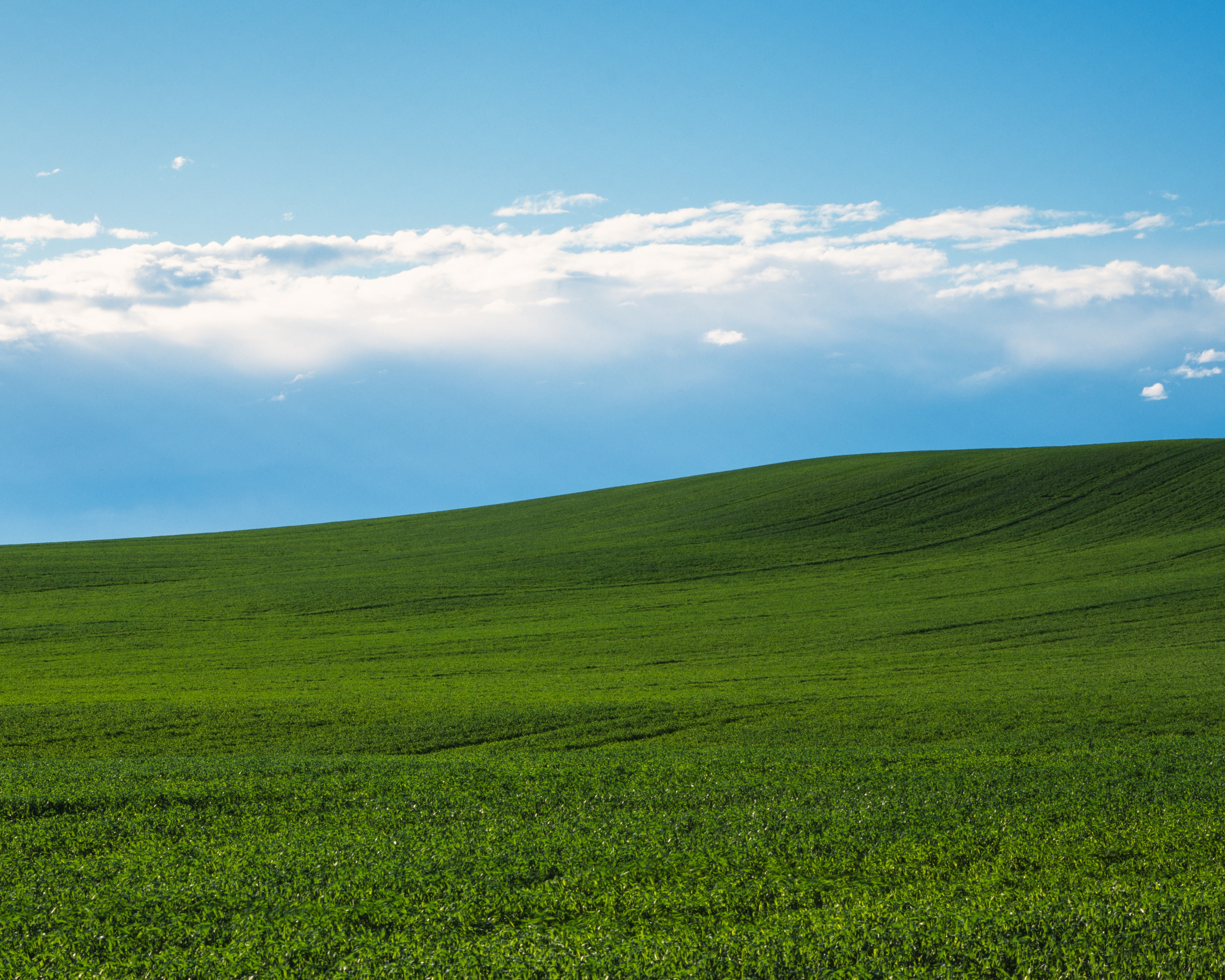 7200x5760 ITAP of some rolling green hills and a cloudy blue sky