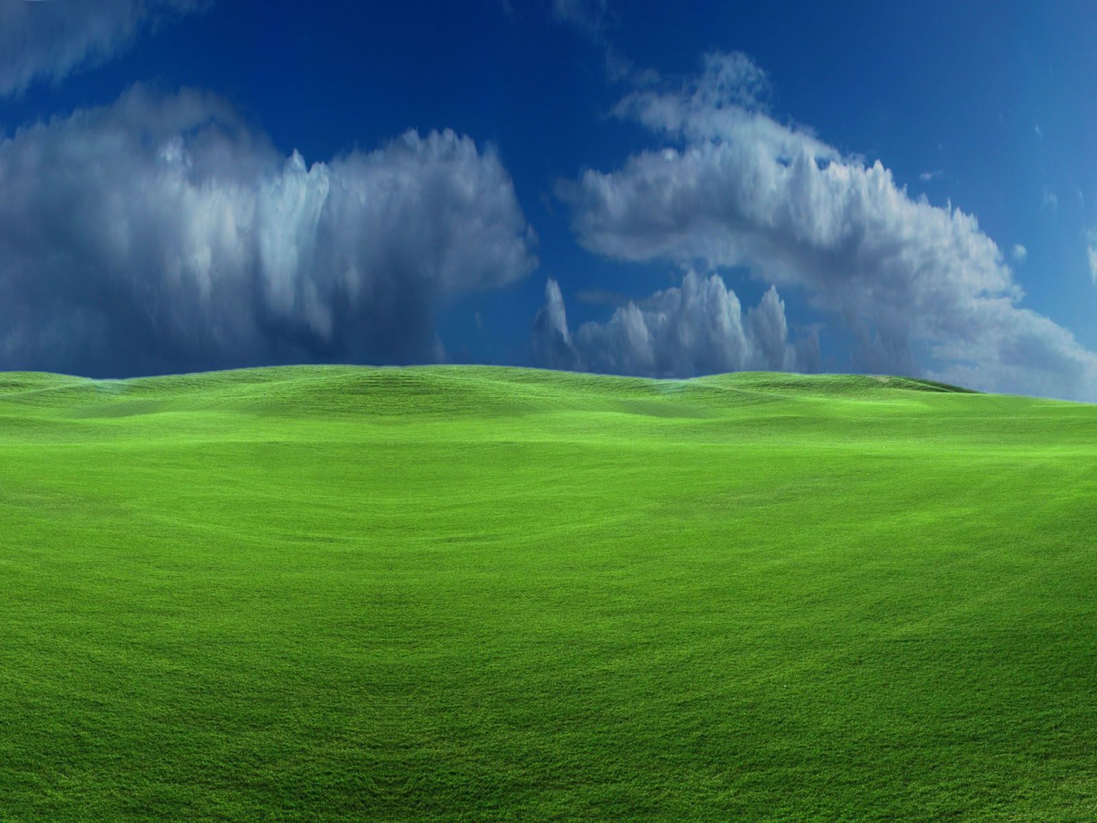 1600x1200 A hill covered with green
