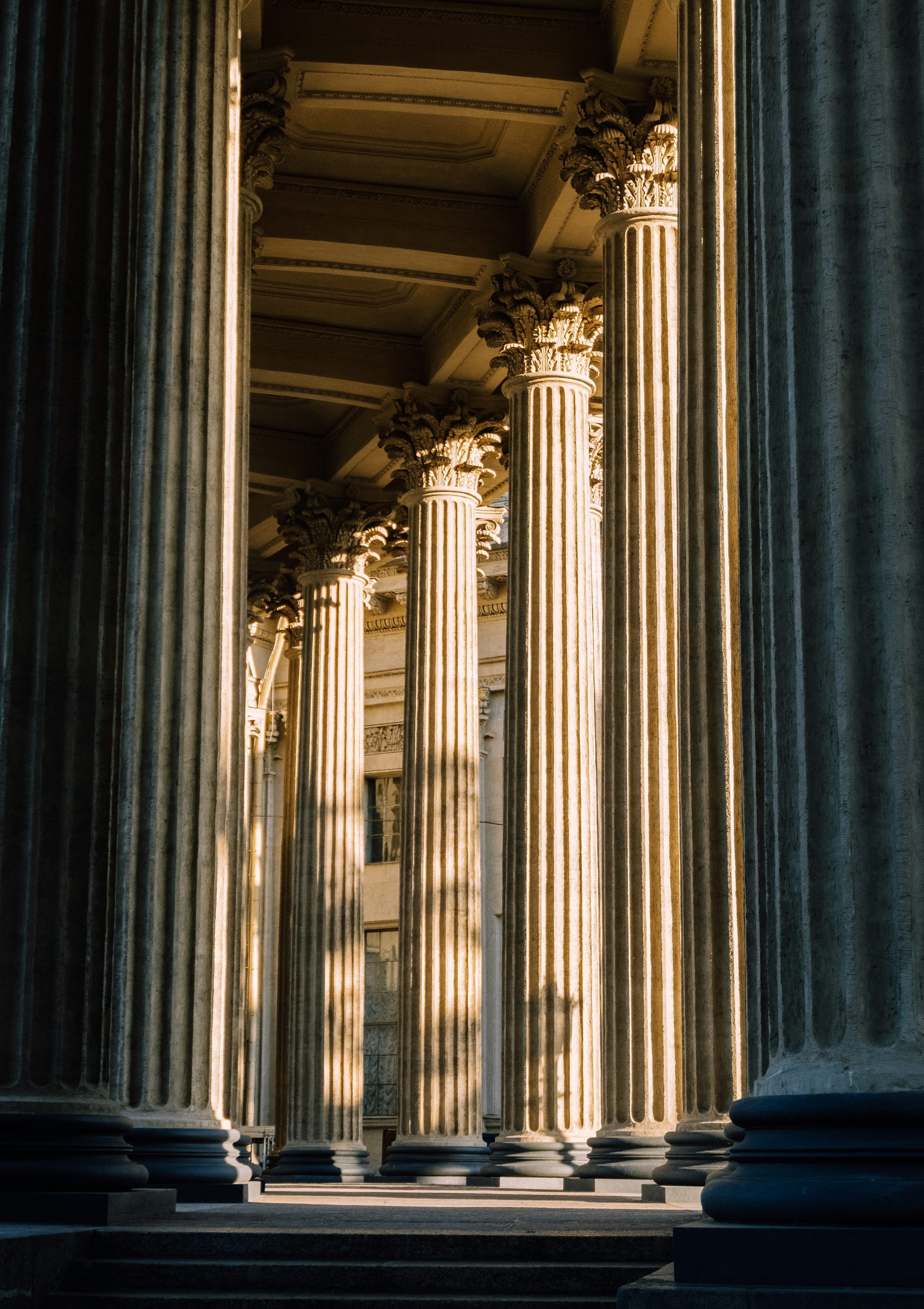 3000x4248 A large building with columns on the side of it photo